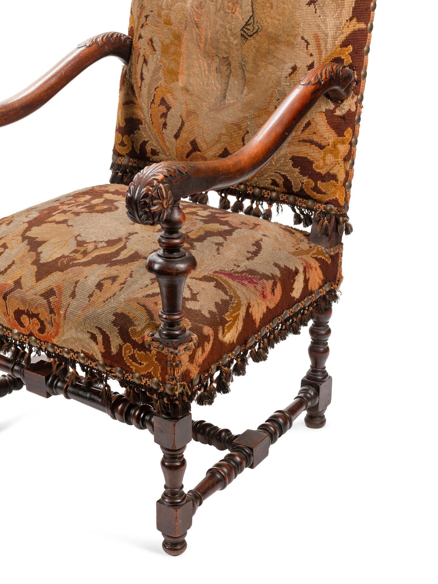 A Pair of William and Mary Style Carved Walnut Armchairs