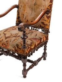 A Pair of William and Mary Style Carved Walnut Armchairs