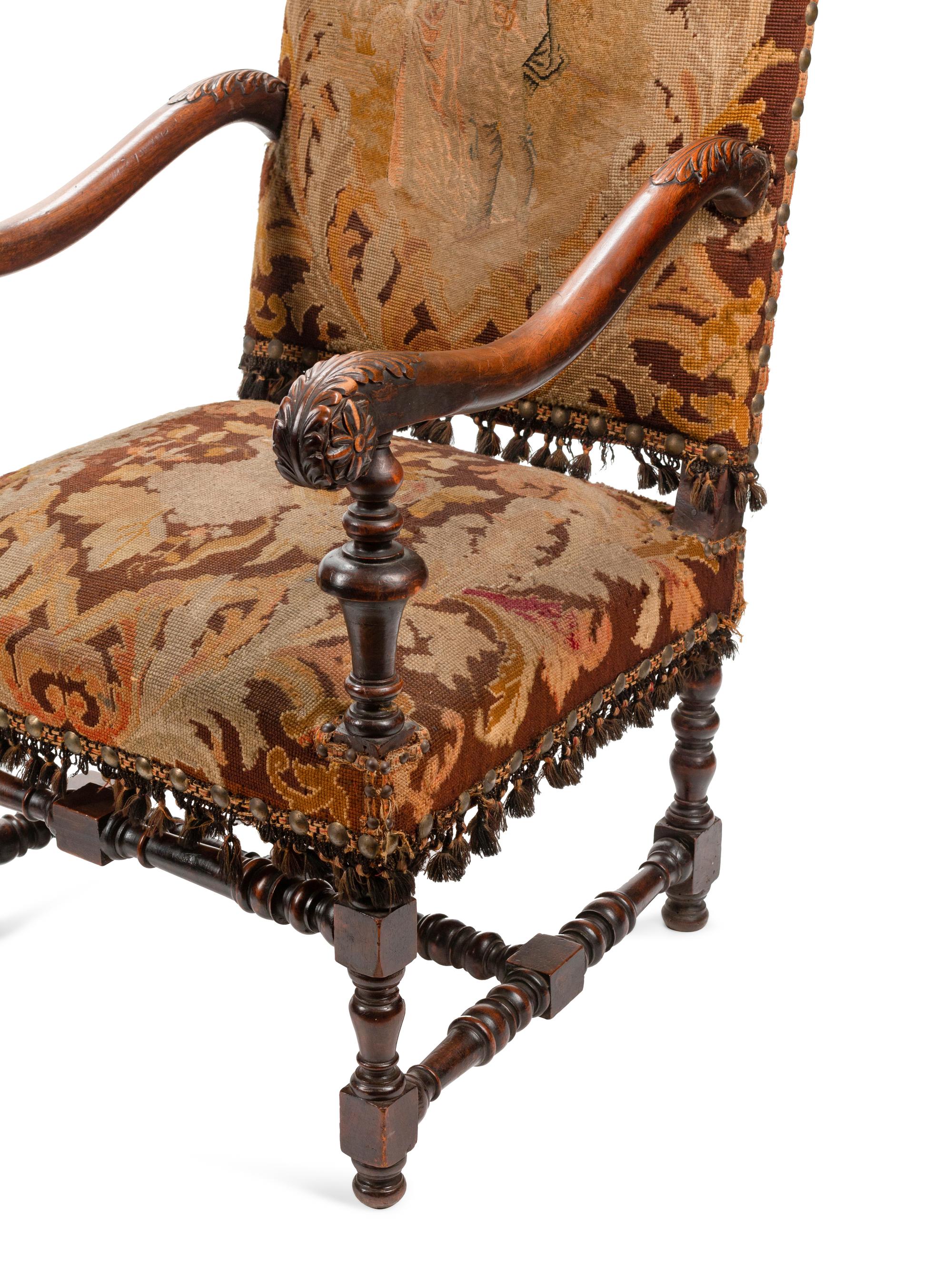 A Pair of William and Mary Style Carved Walnut Armchairs