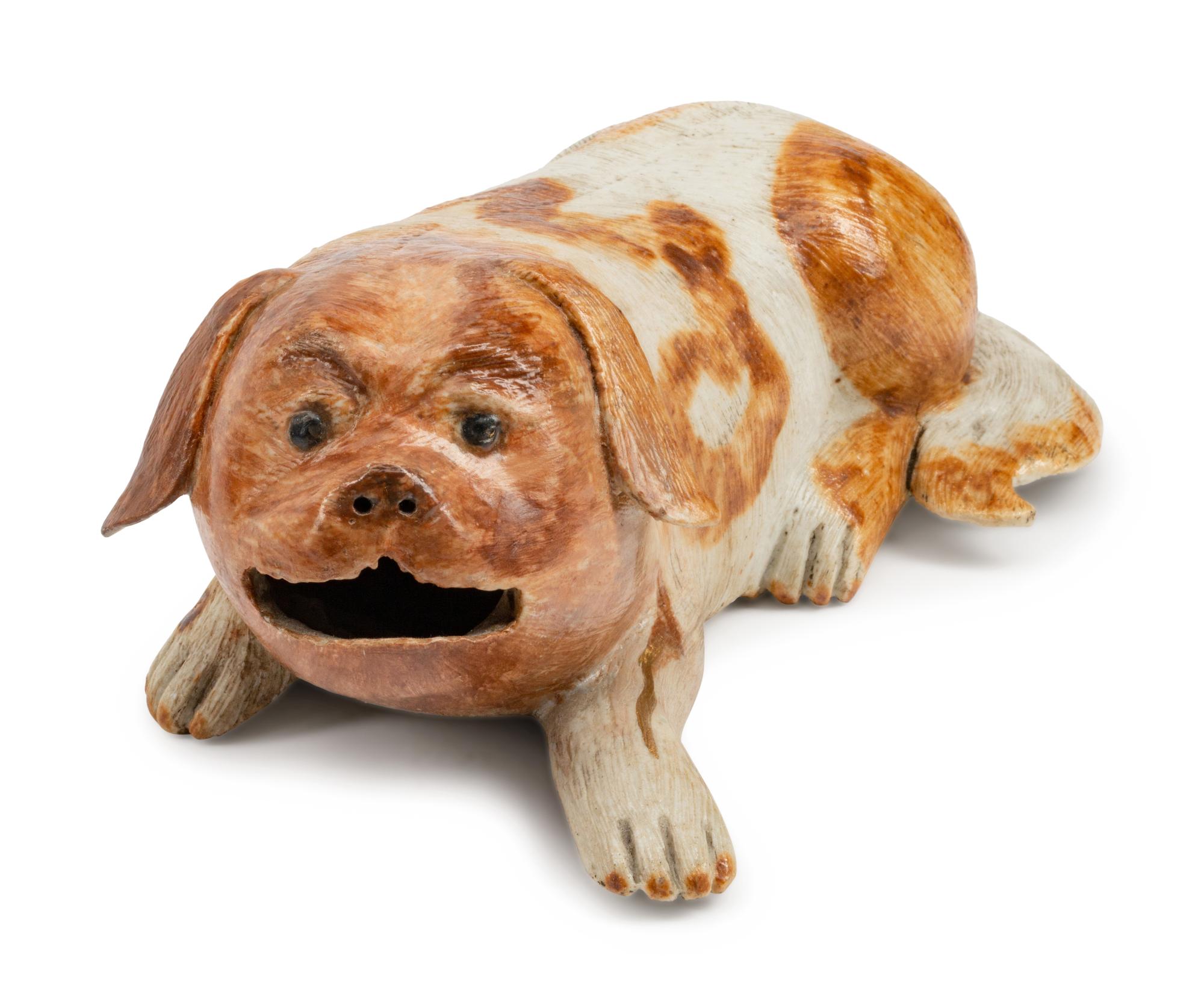 A Chinese Export Porcelain Figure of a Recumbent Dog — 19TH CENTURY