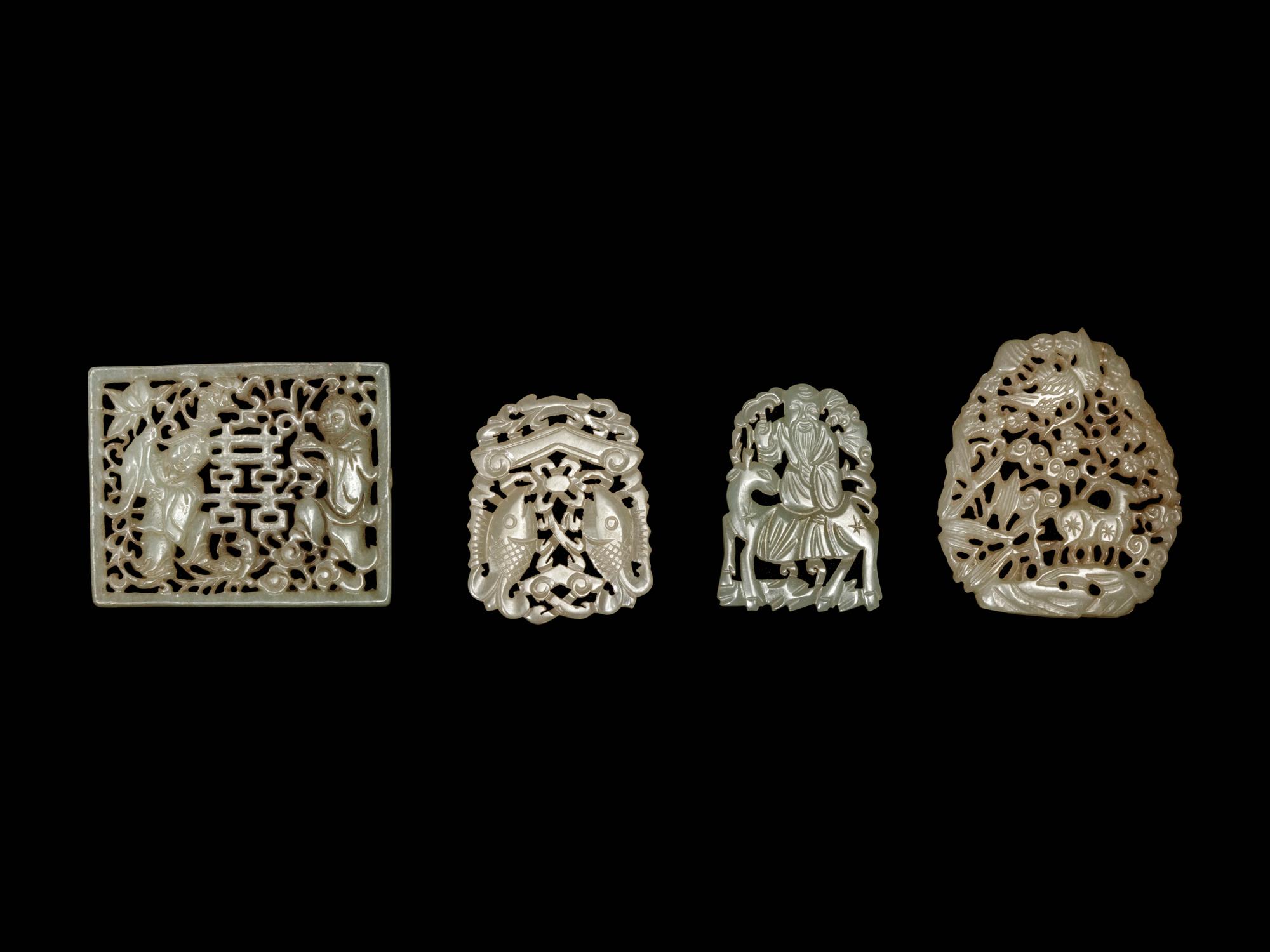 Four Chinese Celadon Jade Reticulated Plaques