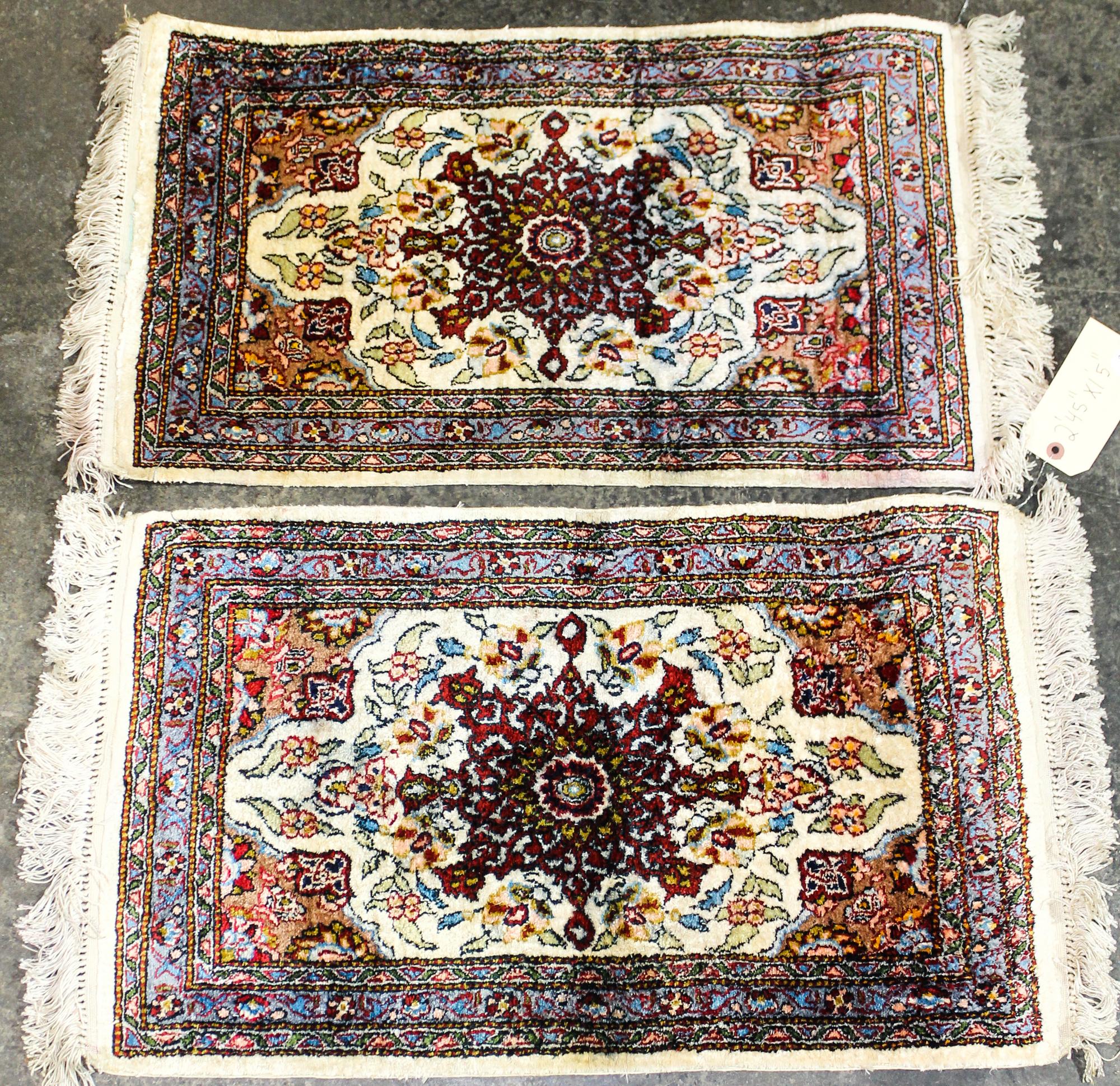 Two Wool Prayer Rugs Dimensions of largest 2 feet 4 1/2 inches x 1 foot 5 inches.