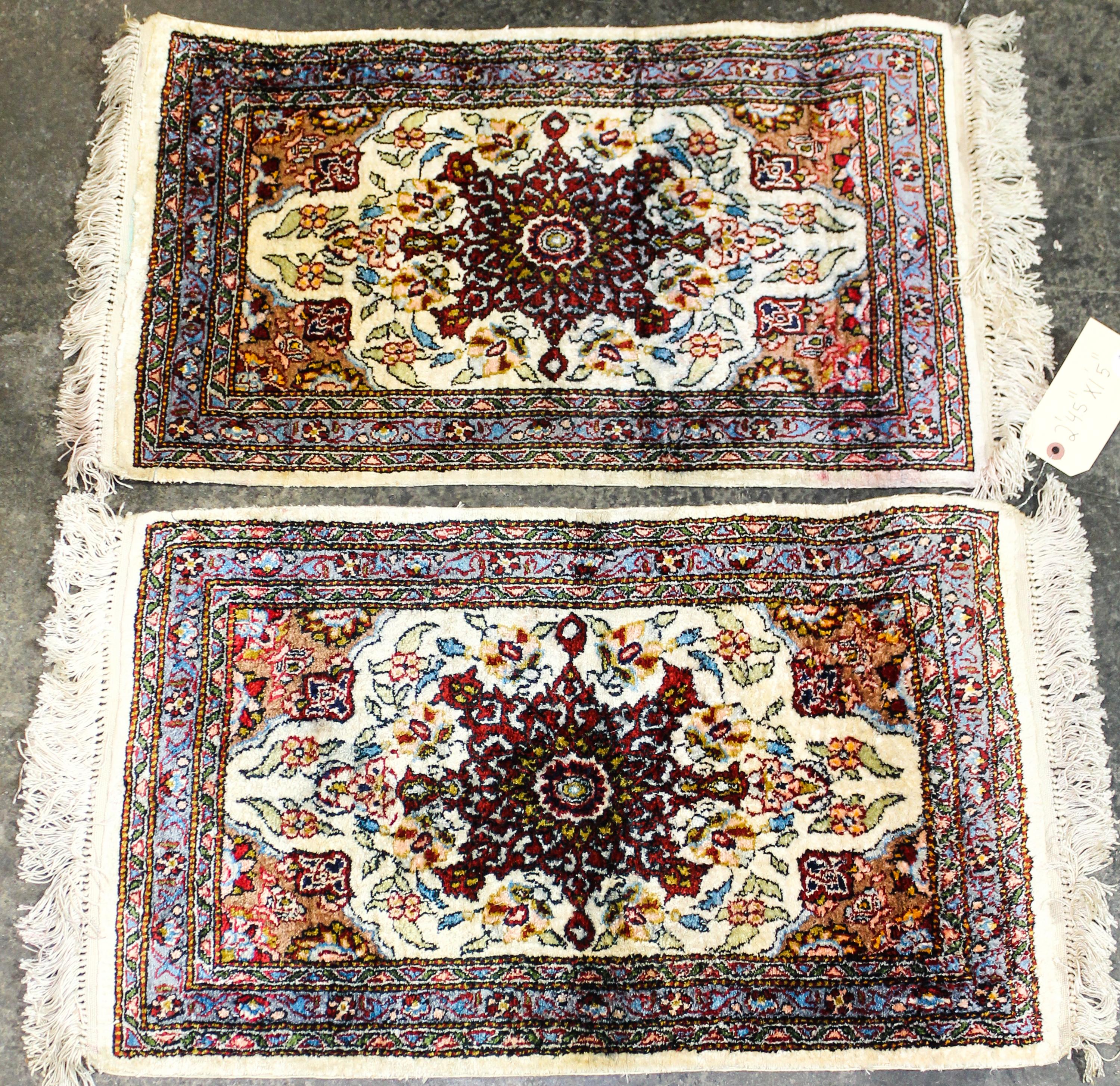 Two Wool Prayer Rugs Dimensions of largest 2 feet 4 1/2 inches x 1 foot 5 inches.