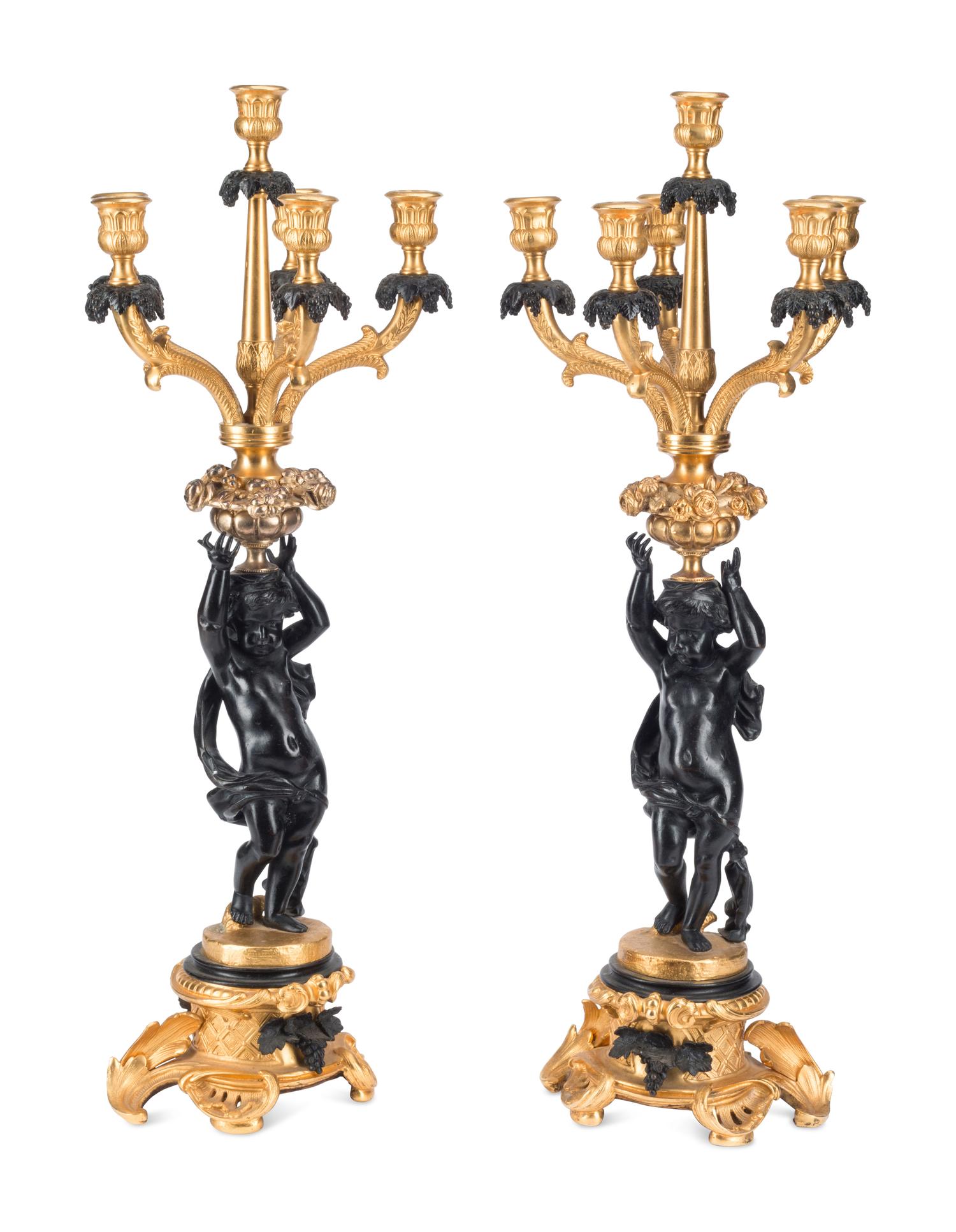 A Pair of French Gilt and Patinated Bronze Figural Six-Light Candelabra