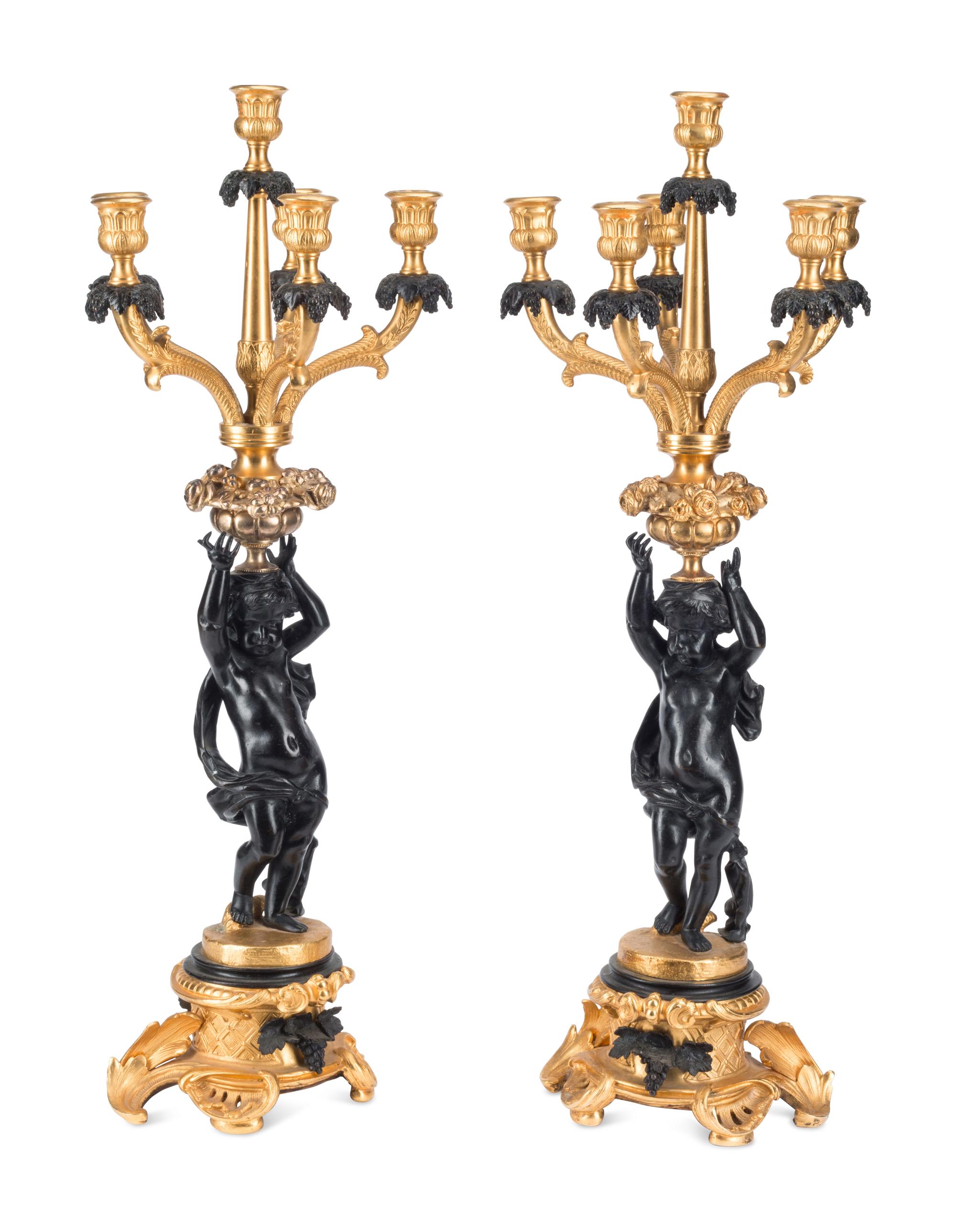 A Pair of French Gilt and Patinated Bronze Figural Six-Light Candelabra