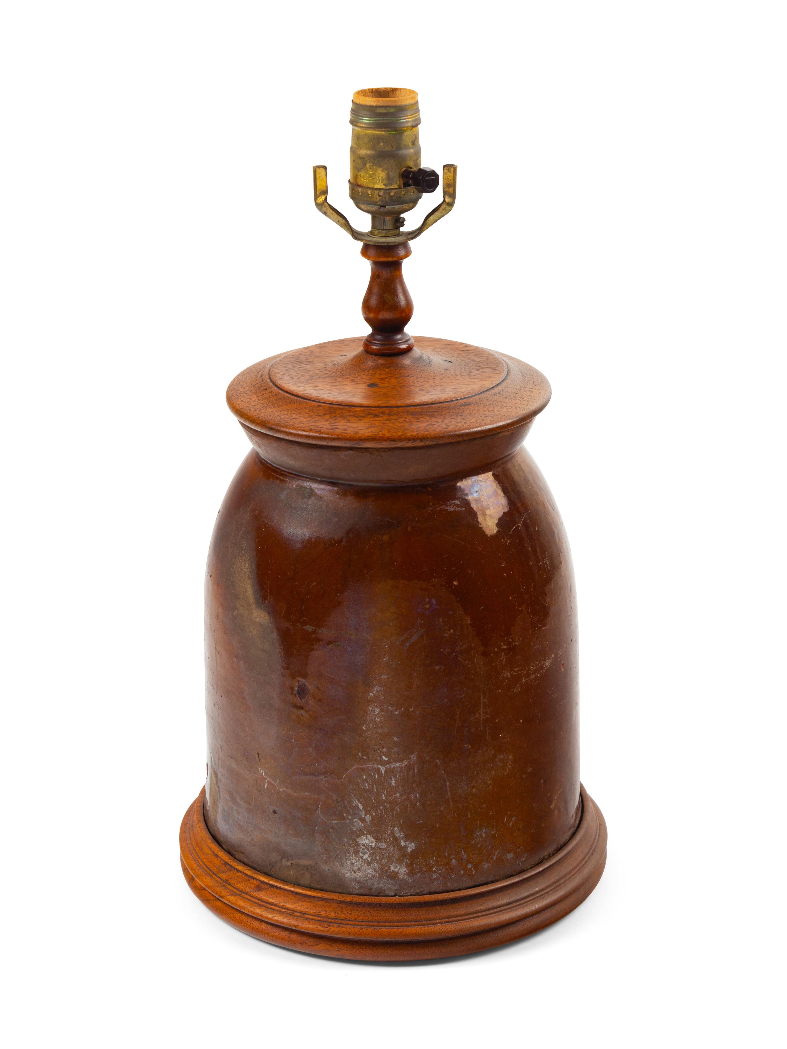 A Brown Glazed Stoneware Crock with a Later Crewel Work Shade