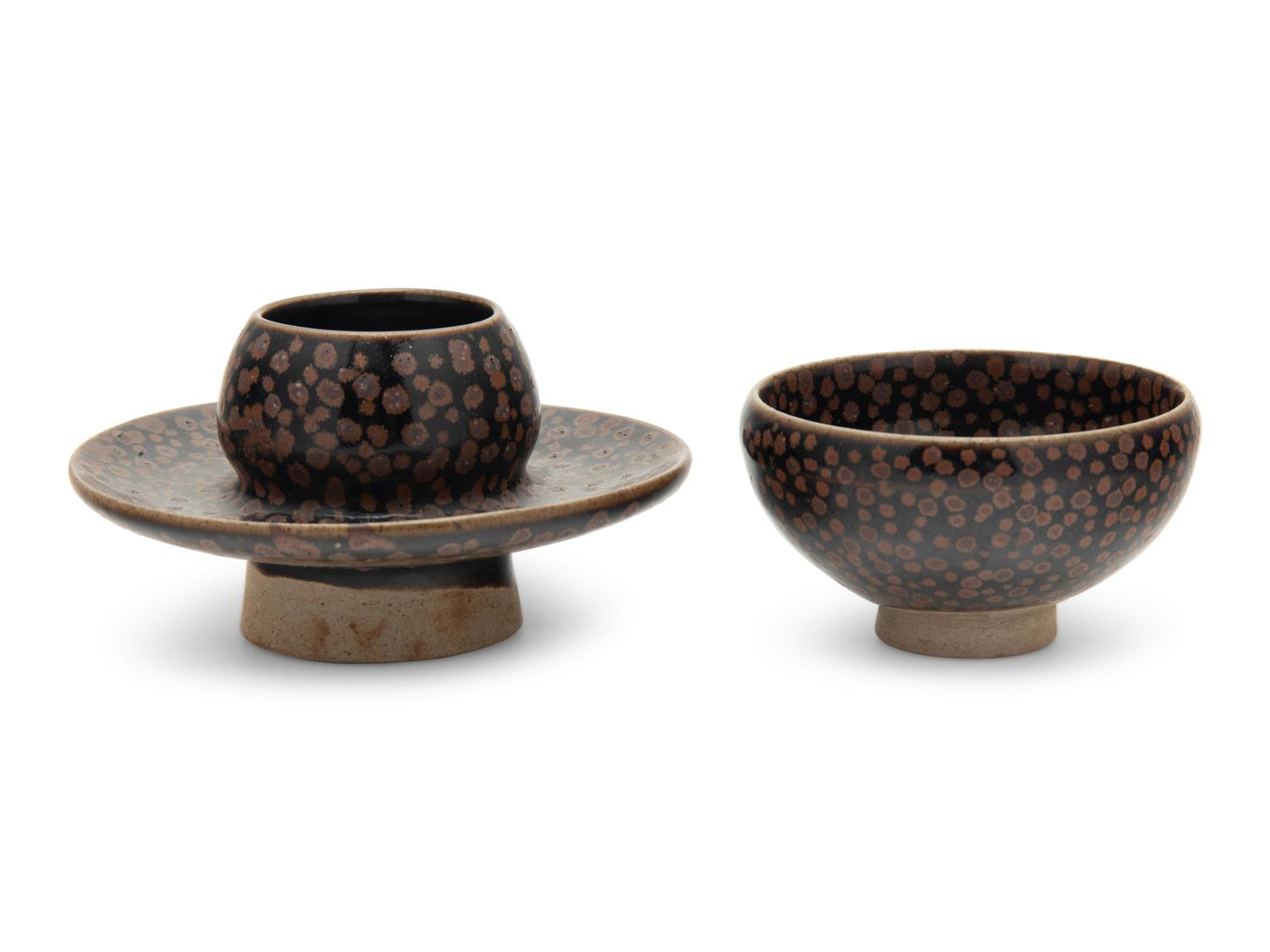 A Chinese Brown Splashed and Black Glazed Stoneware Teacup and Stand