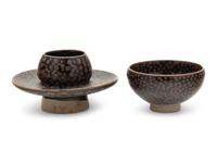 A Chinese Brown Splashed and Black Glazed Stoneware Teacup and Stand