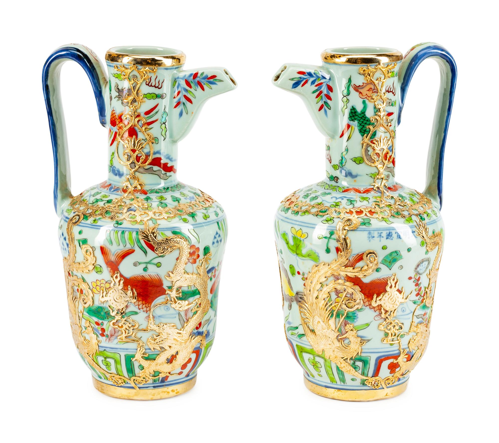 A Pair of Chinese Bronze-Mounted Porcelain Ewers