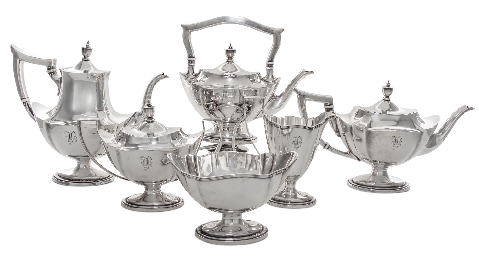 An American Silver Tea and Coffee Service, Gorham Mfg. Co., Providence, RI, comprising a kettle on lampstand, a coffee pot, a teapot, a