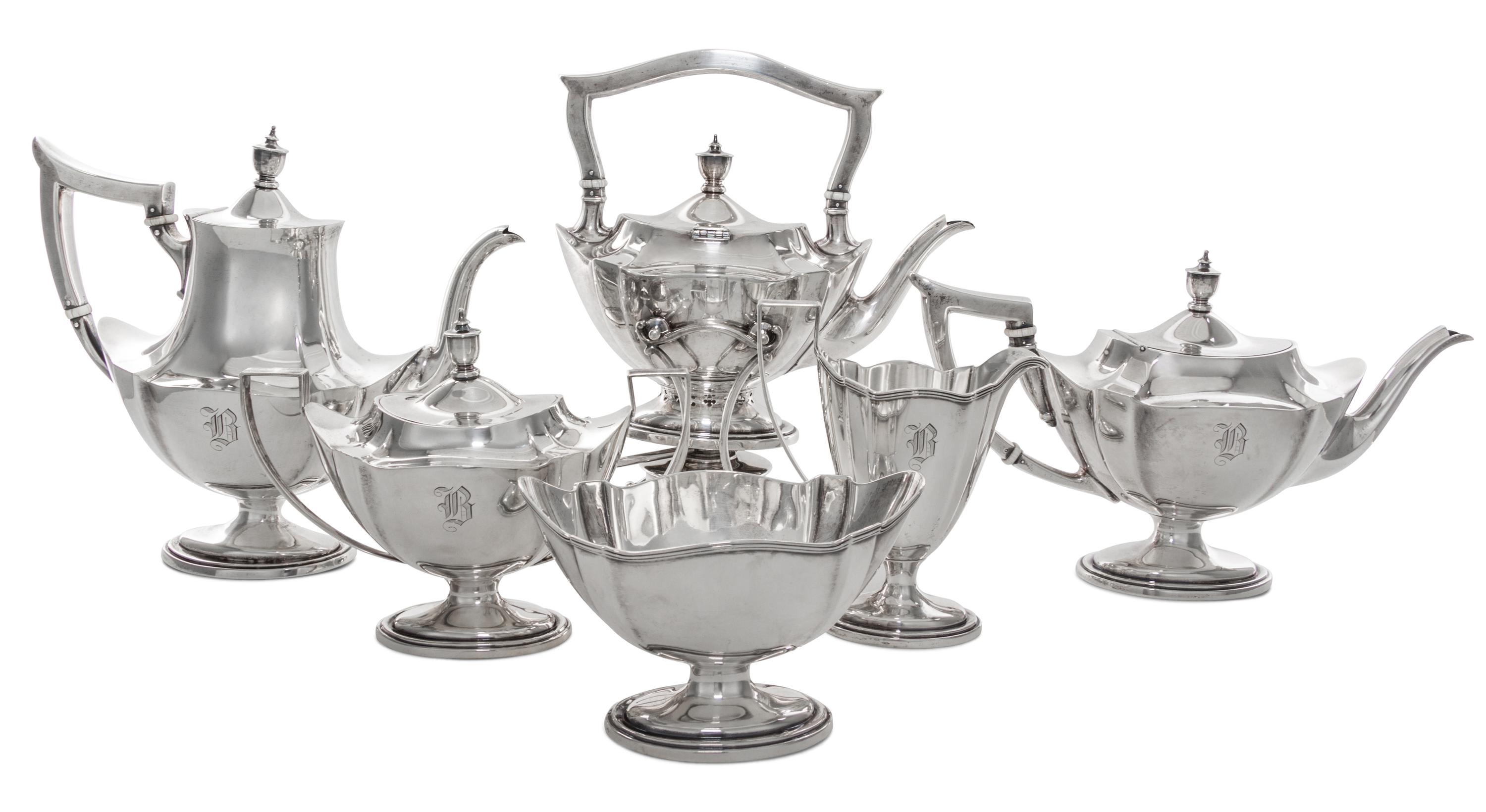 An American Silver Tea and Coffee Service, Gorham Mfg. Co., Providence, RI, comprising a kettle on lampstand, a coffee pot, a teapot, a