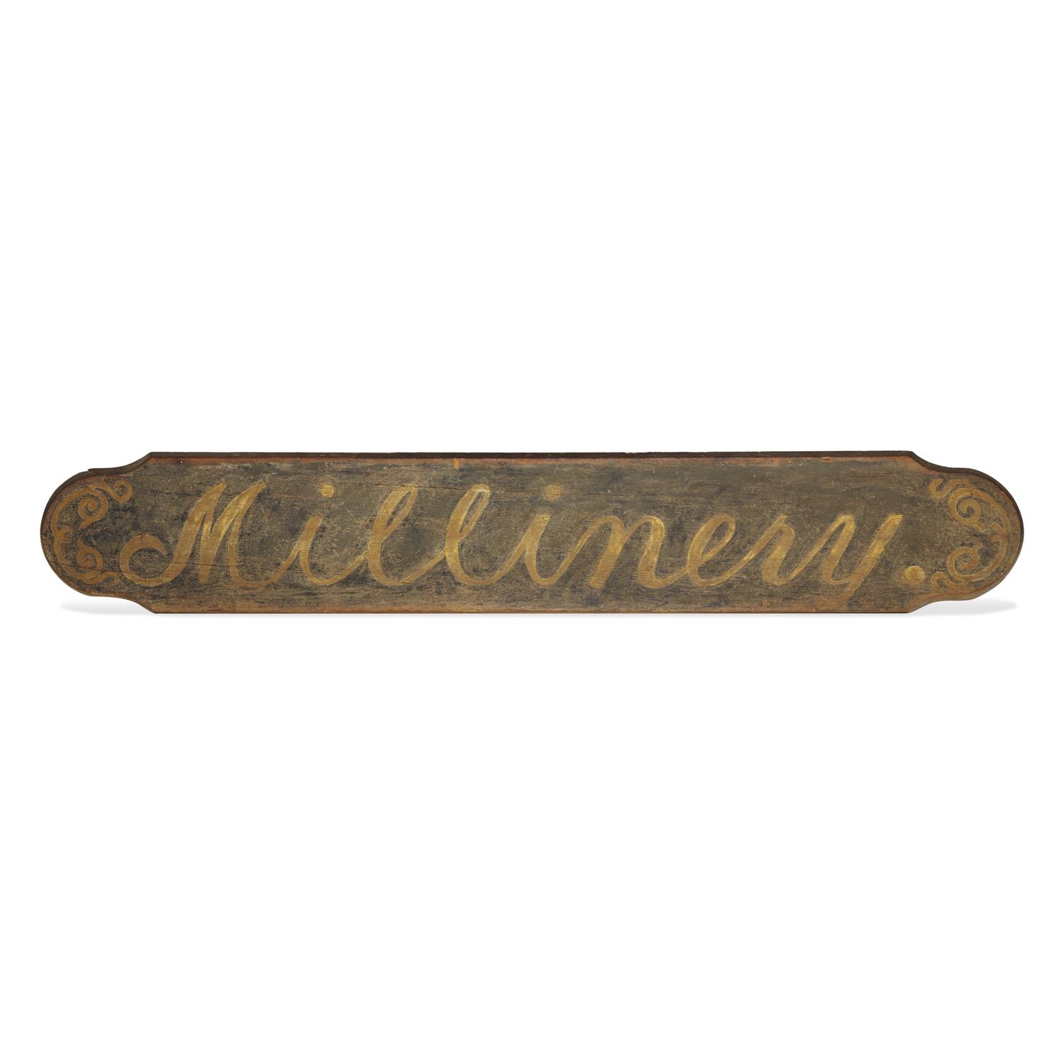A Painted Wood "Millinery" Trade Sign