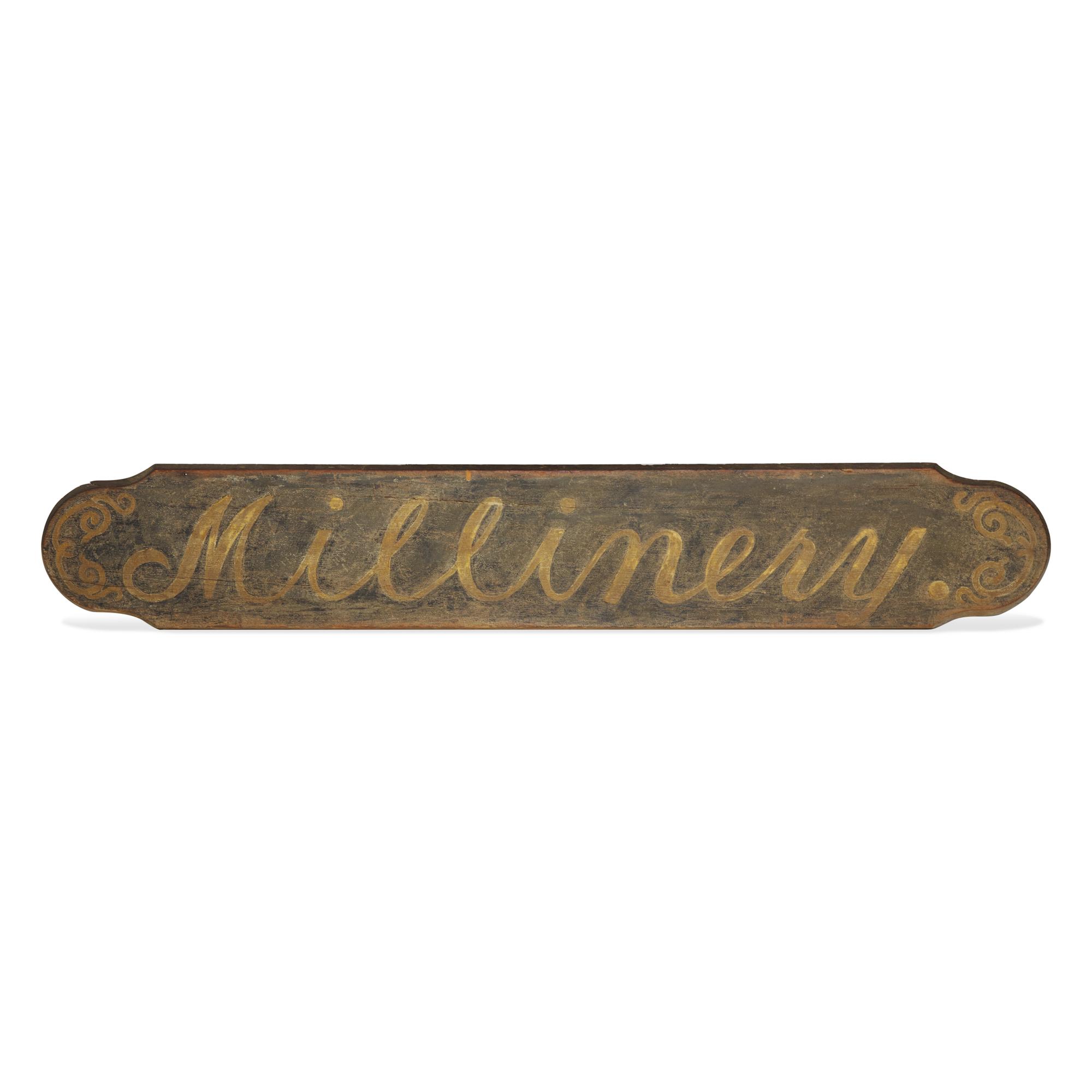 A Painted Wood "Millinery" Trade Sign