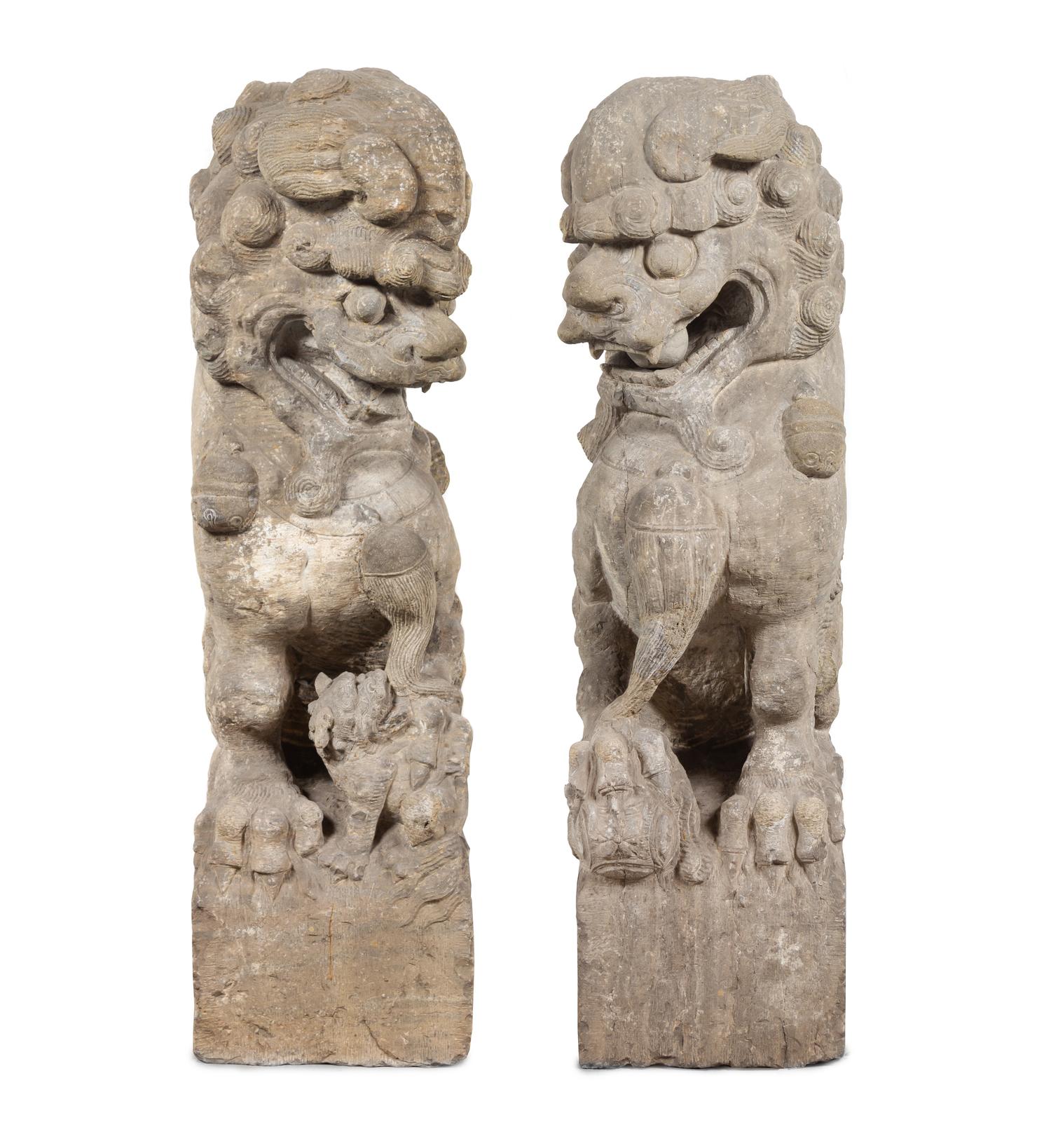 A Pair of Large Carved Stone Figures of Fu Lions