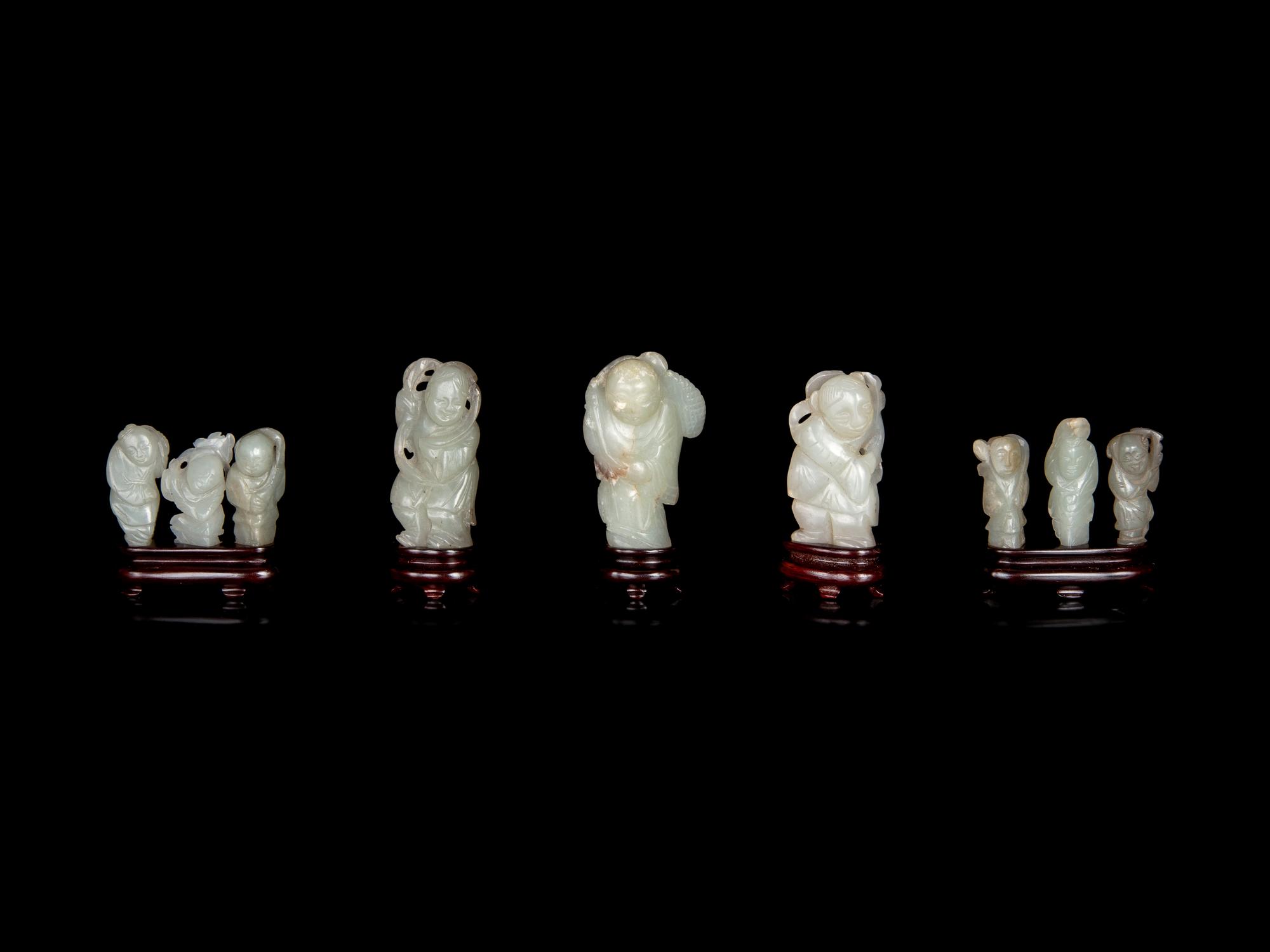 Nine Chinese Carved Celadon Jade Figures of Boys