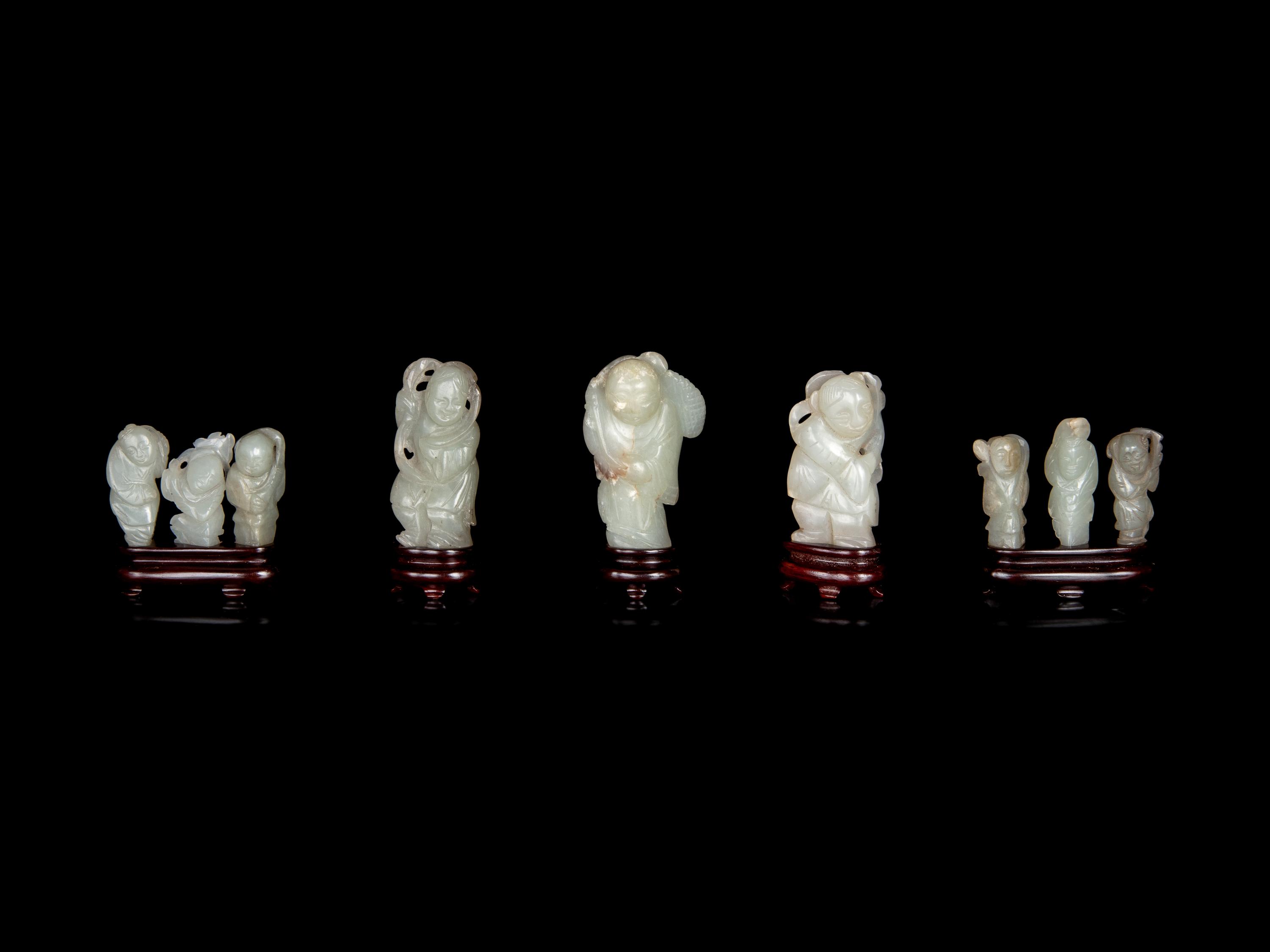 Nine Chinese Carved Celadon Jade Figures of Boys