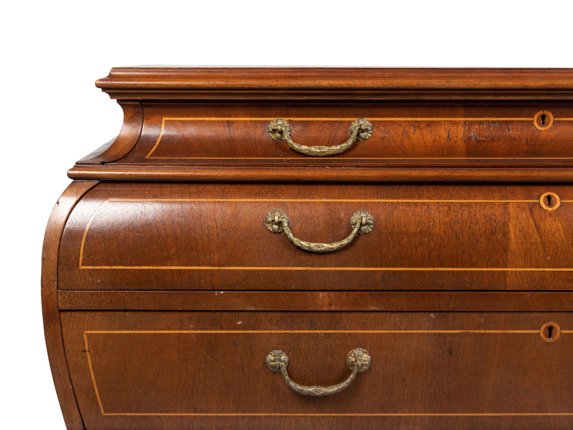 A Louis XV Style Walnut Bombe Commode