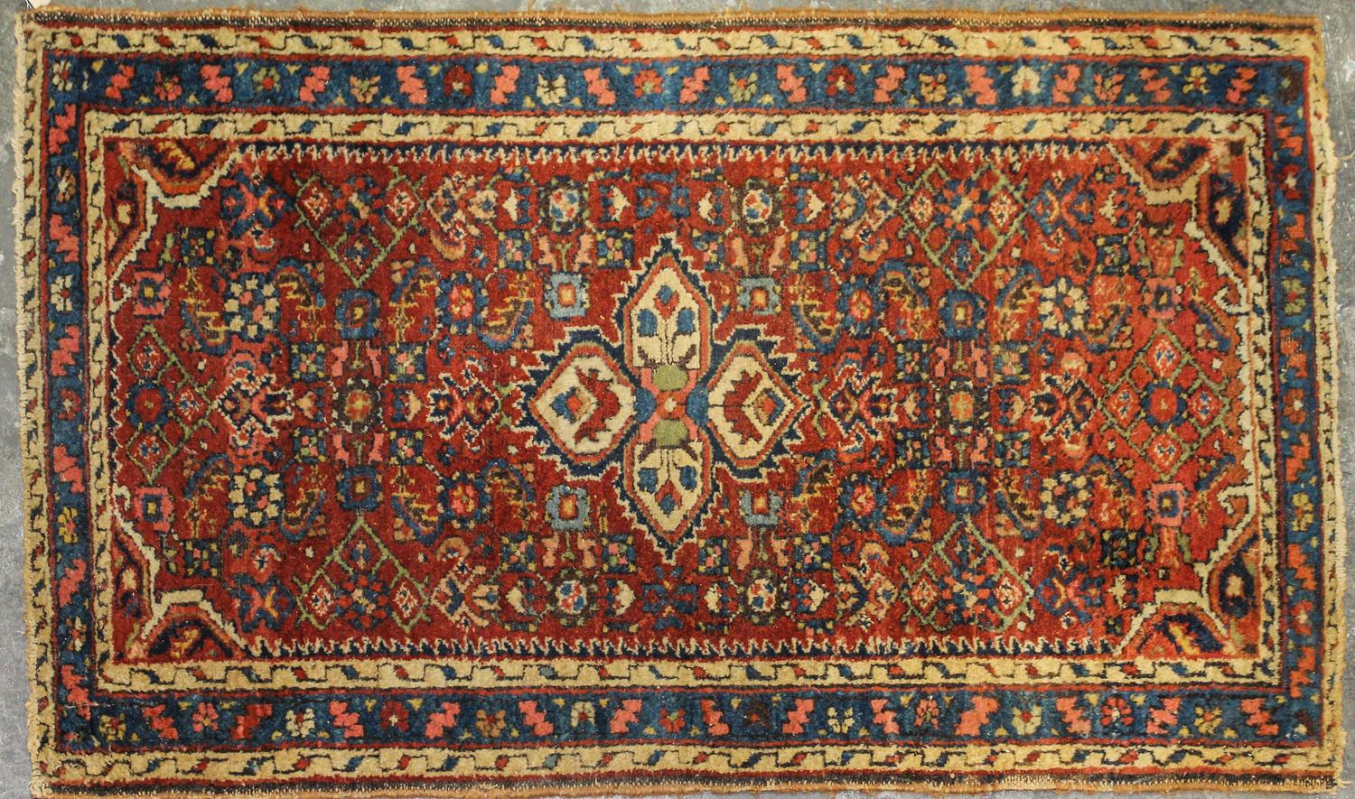 A Sarouk Wool Mat 3 feet 11 inches x 2 feet 4 inches.