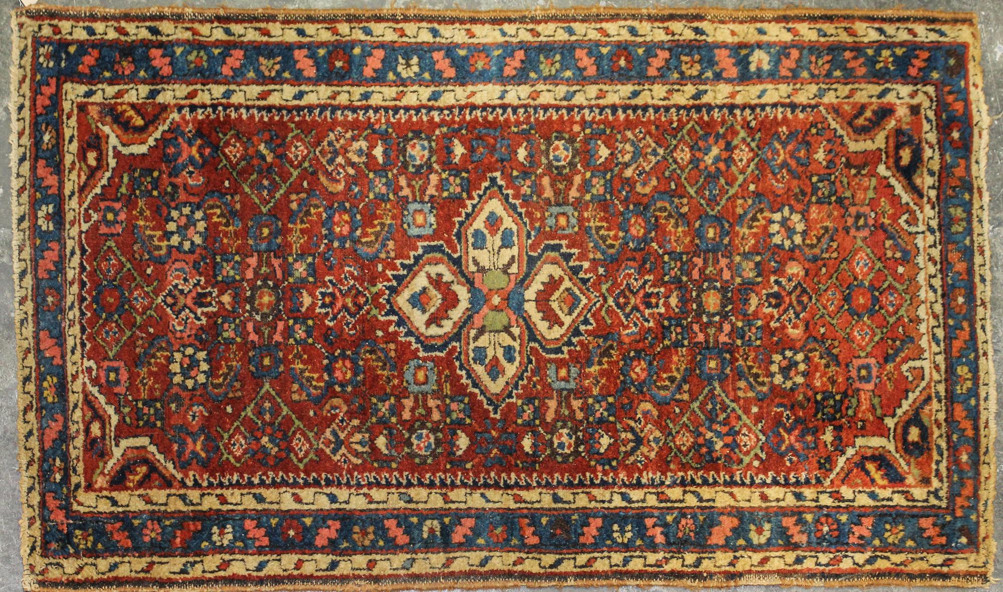 A Sarouk Wool Mat 3 feet 11 inches x 2 feet 4 inches.