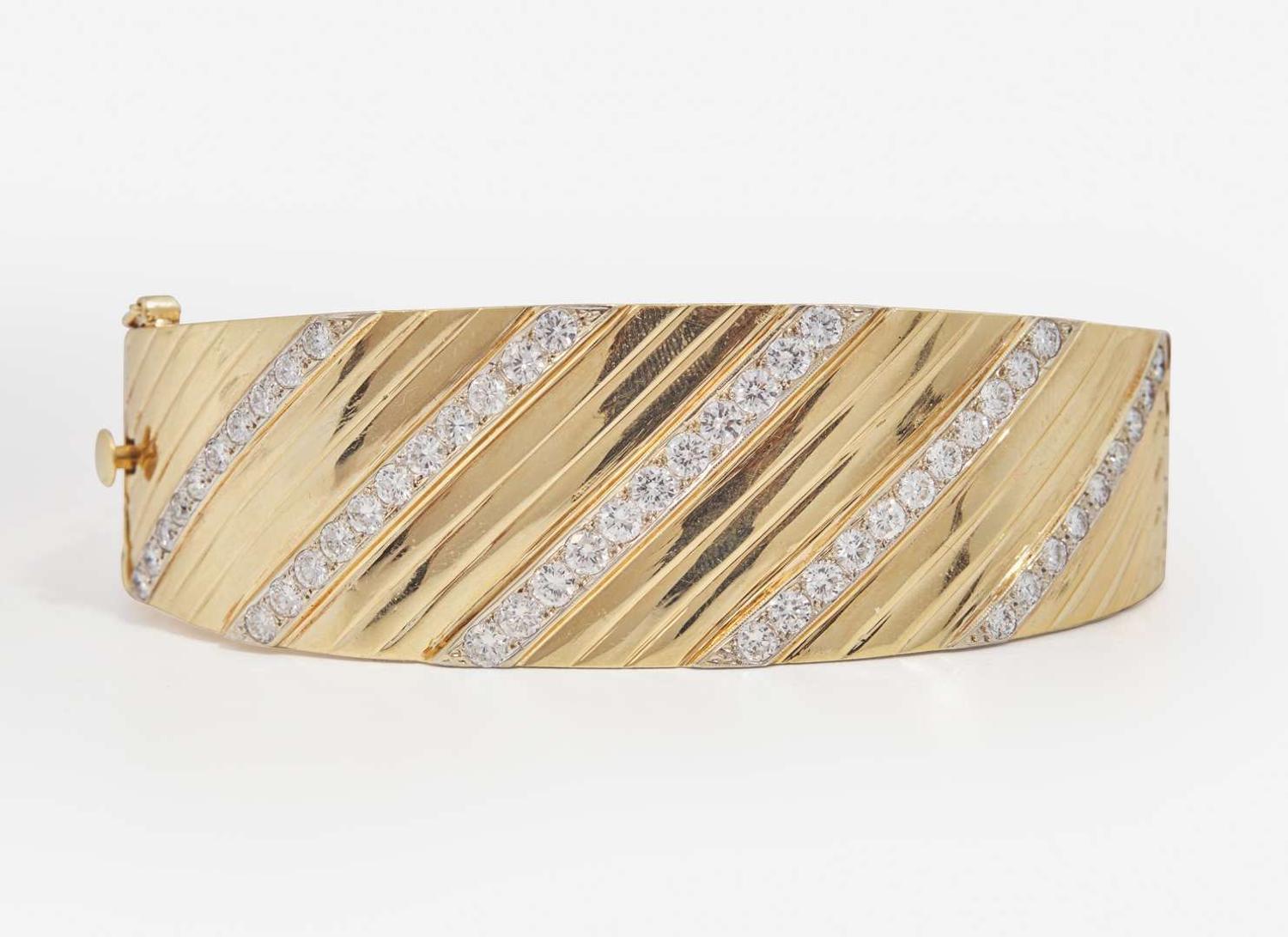 A 14K Yellow Gold and Diamond Bangle Bracelet