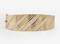 A 14K Yellow Gold and Diamond Bangle Bracelet