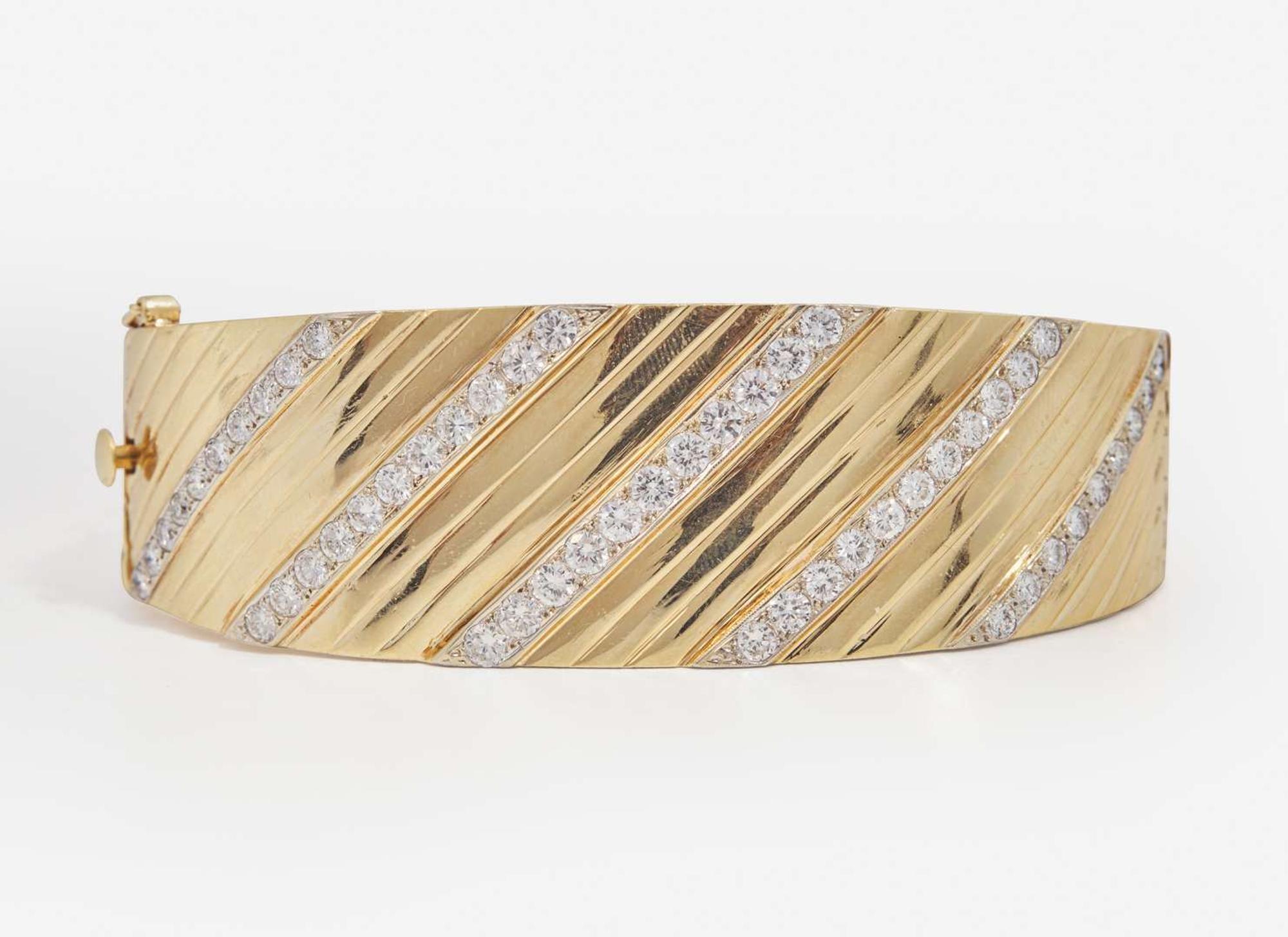 A 14K Yellow Gold and Diamond Bangle Bracelet