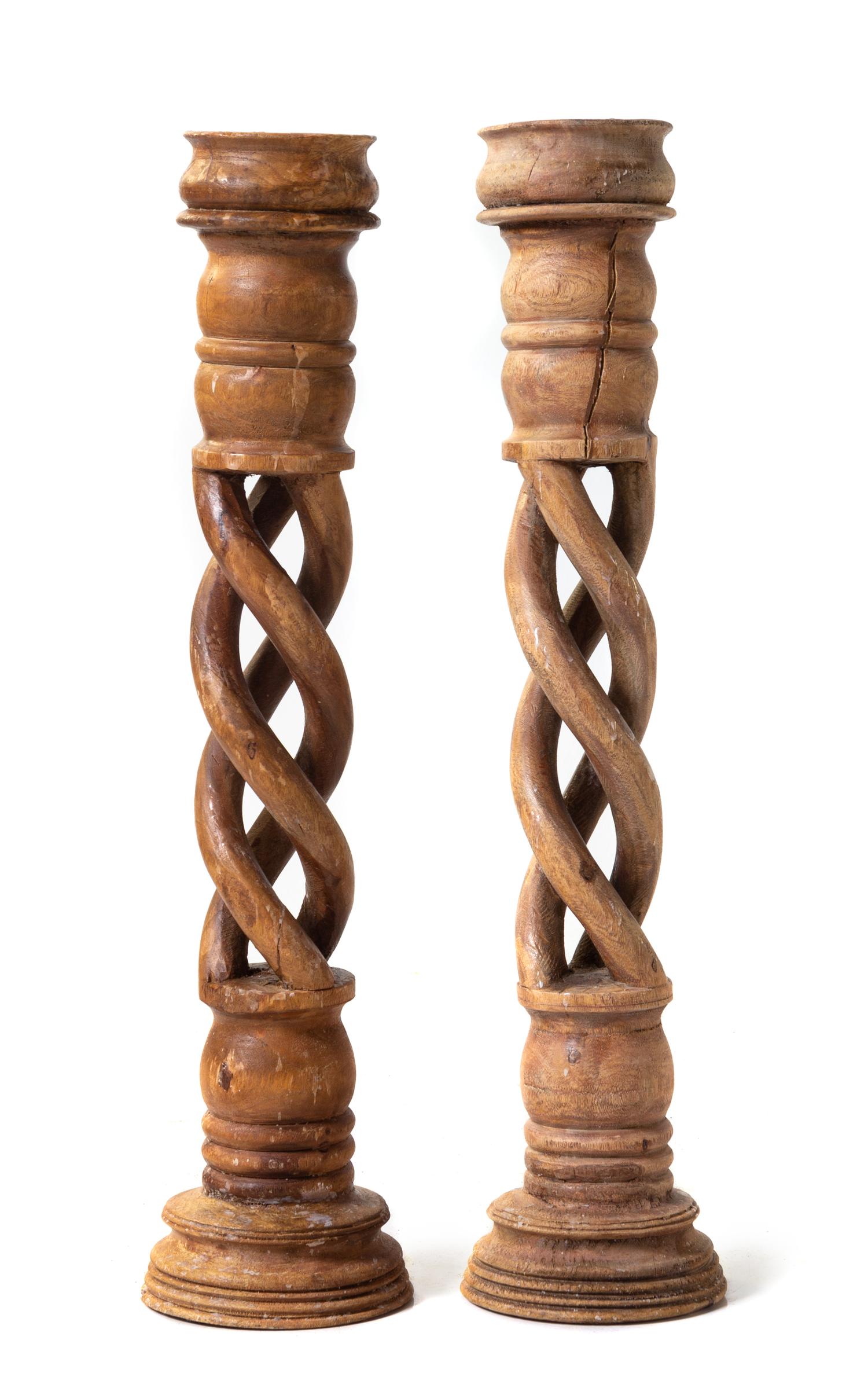 Two Pairs of Carved Barley Twist Candlesticks