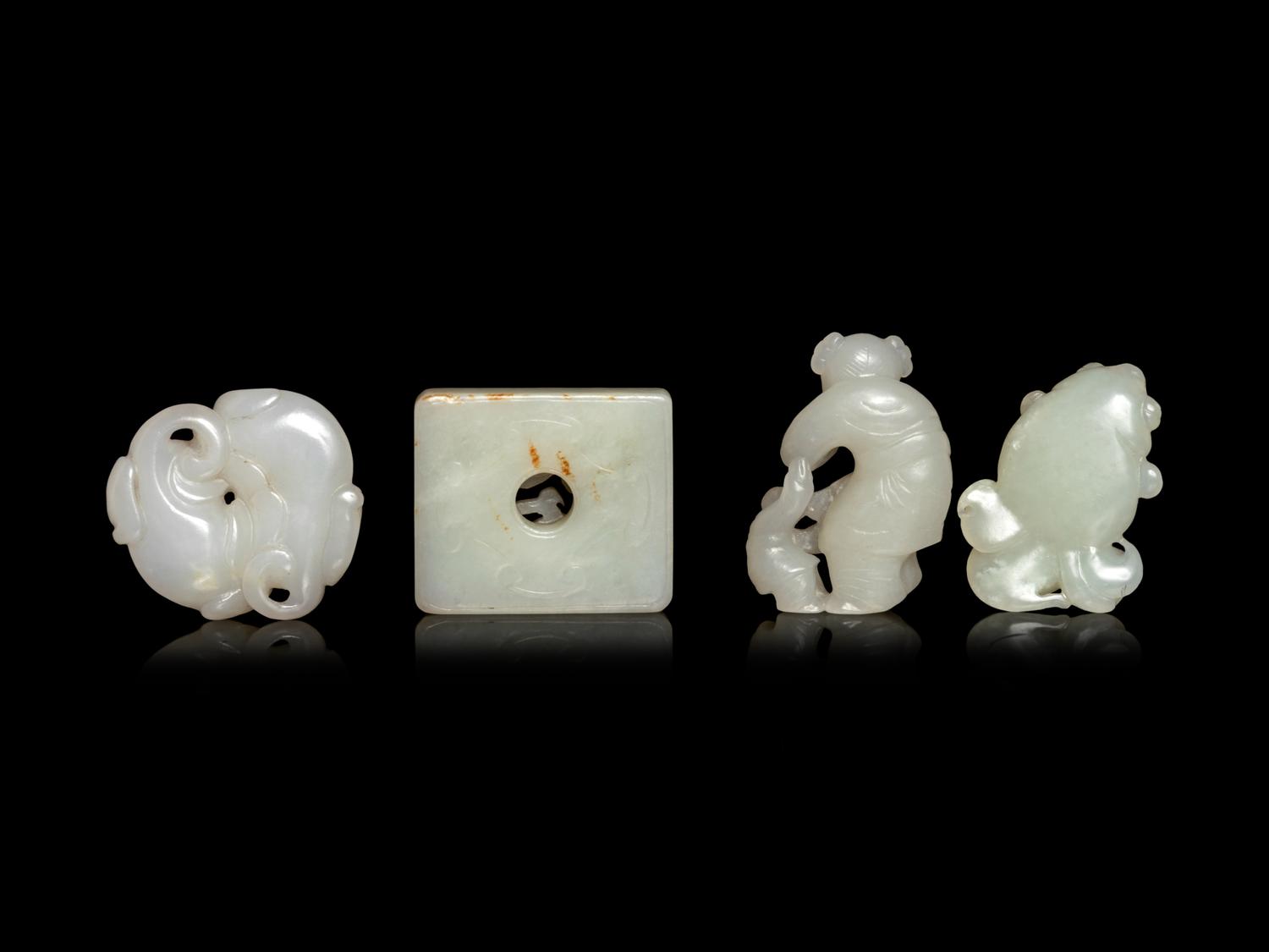 Four Chinese Pale Celadon and White Jade Carvings
