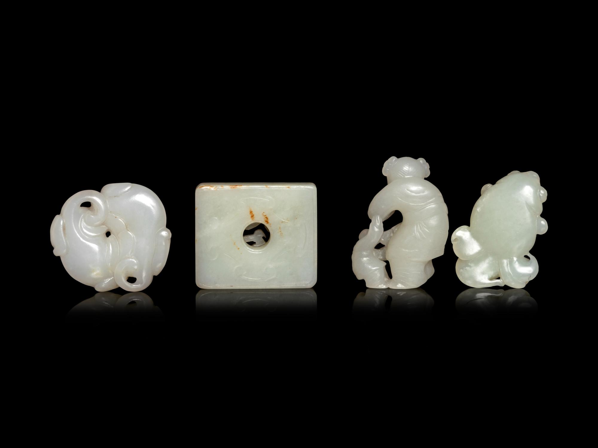 Four Chinese Pale Celadon and White Jade Carvings
