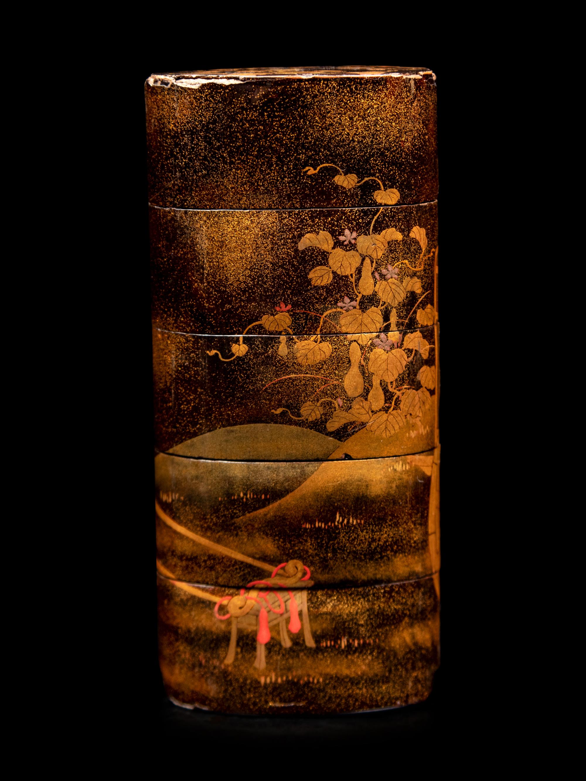 A Gold and Black Lacquer Four-Case Inro