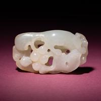 A Chinese Russet and White Jade 'Squirrel and Grape' Carving, 18th/19th Century — 清中期 白玉留皮松鼠葡萄