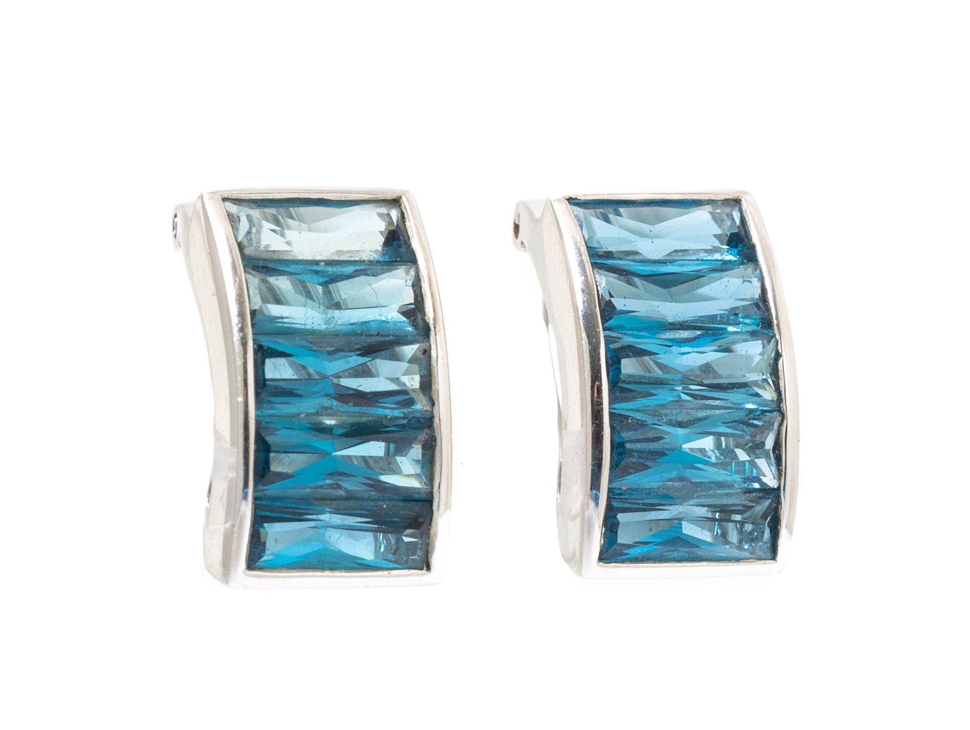 A Pair of 18 Karat White Gold and Blue Topaz Earclips, 7.45 dwts.