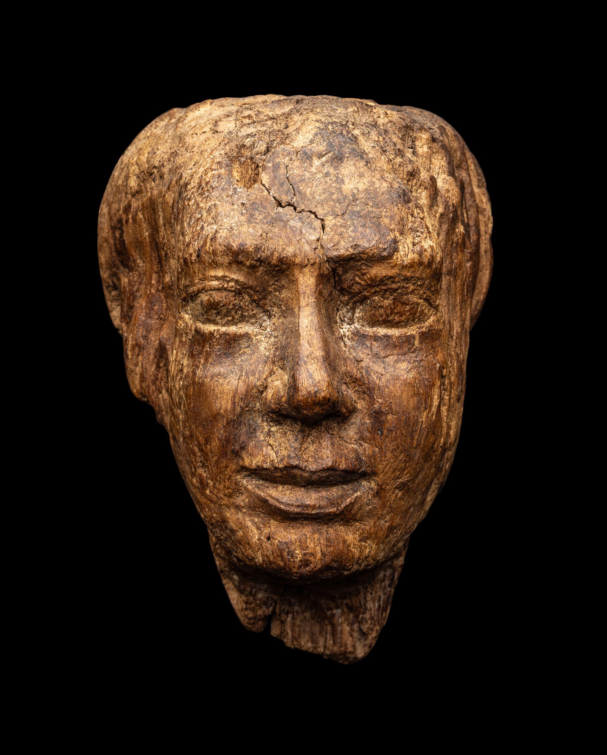 An Egyptian Wood Head of a Priest