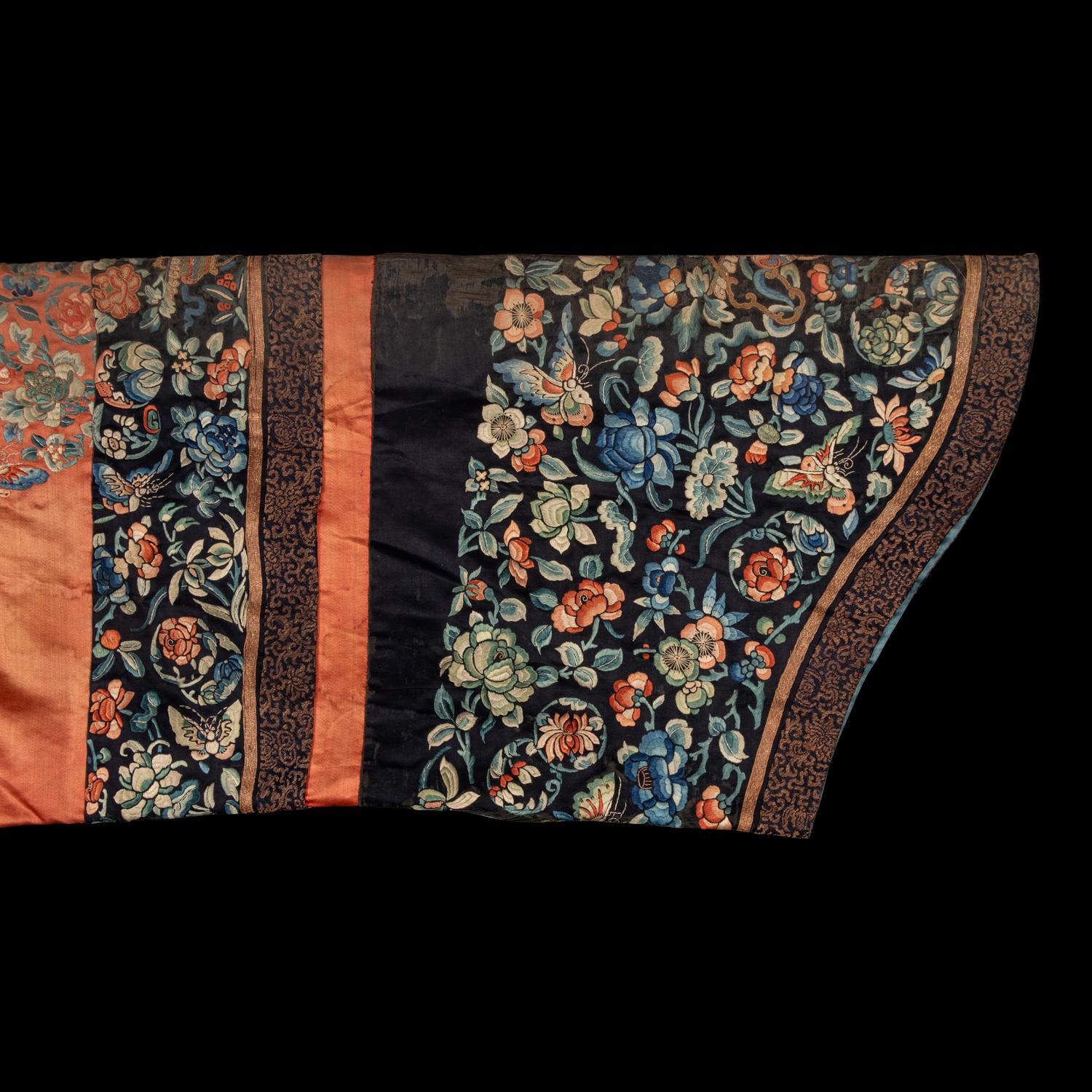 A Chinese Apricot Ground Embroidered 'Peony and Butterfly' Silk Semi-Informal Lady's Robe, Jifupao, late 18th/19th Century 清中期 杏子緞繡八團蝶戀花吉服袍