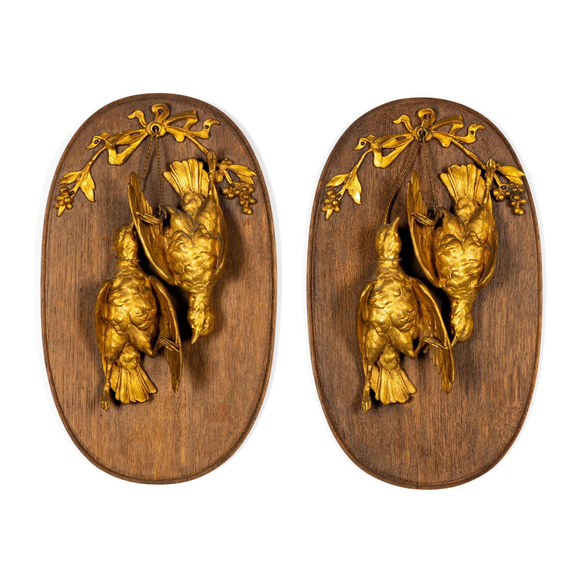 A Pair of Gilt Bronze and Walnut Hunt Plaques