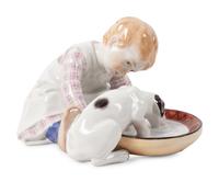 A Meissen Porcelain Figural Group of a Child Feeding Dog, by Konrad Hentschel