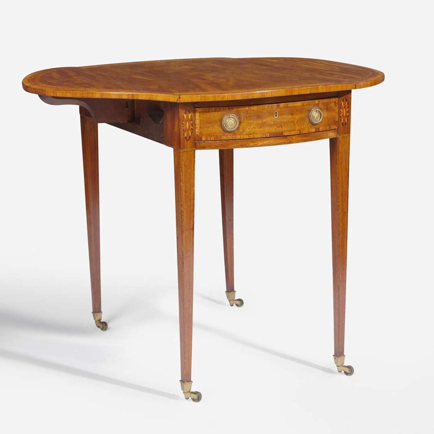 A George III oval inlaid mahogany and satinwood pembroke table circa 1780