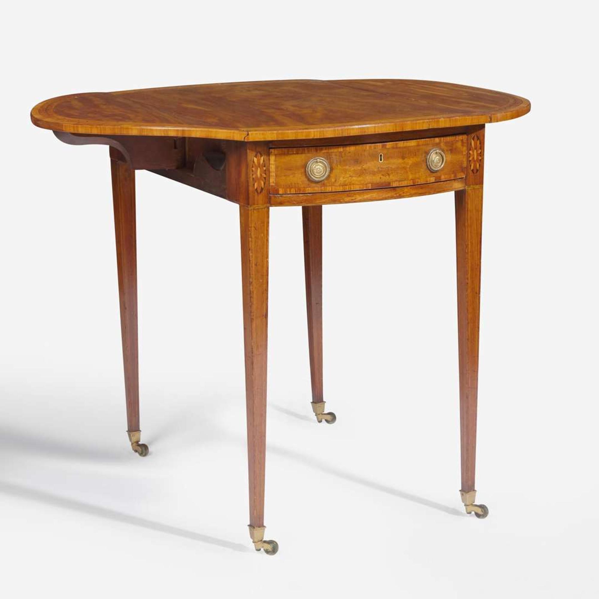 A George III oval inlaid mahogany and satinwood pembroke table circa 1780