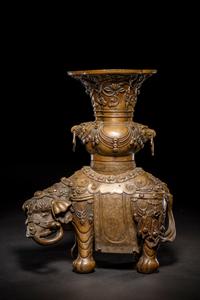 An Embellished Bronze Figure of an Elephant and Vase