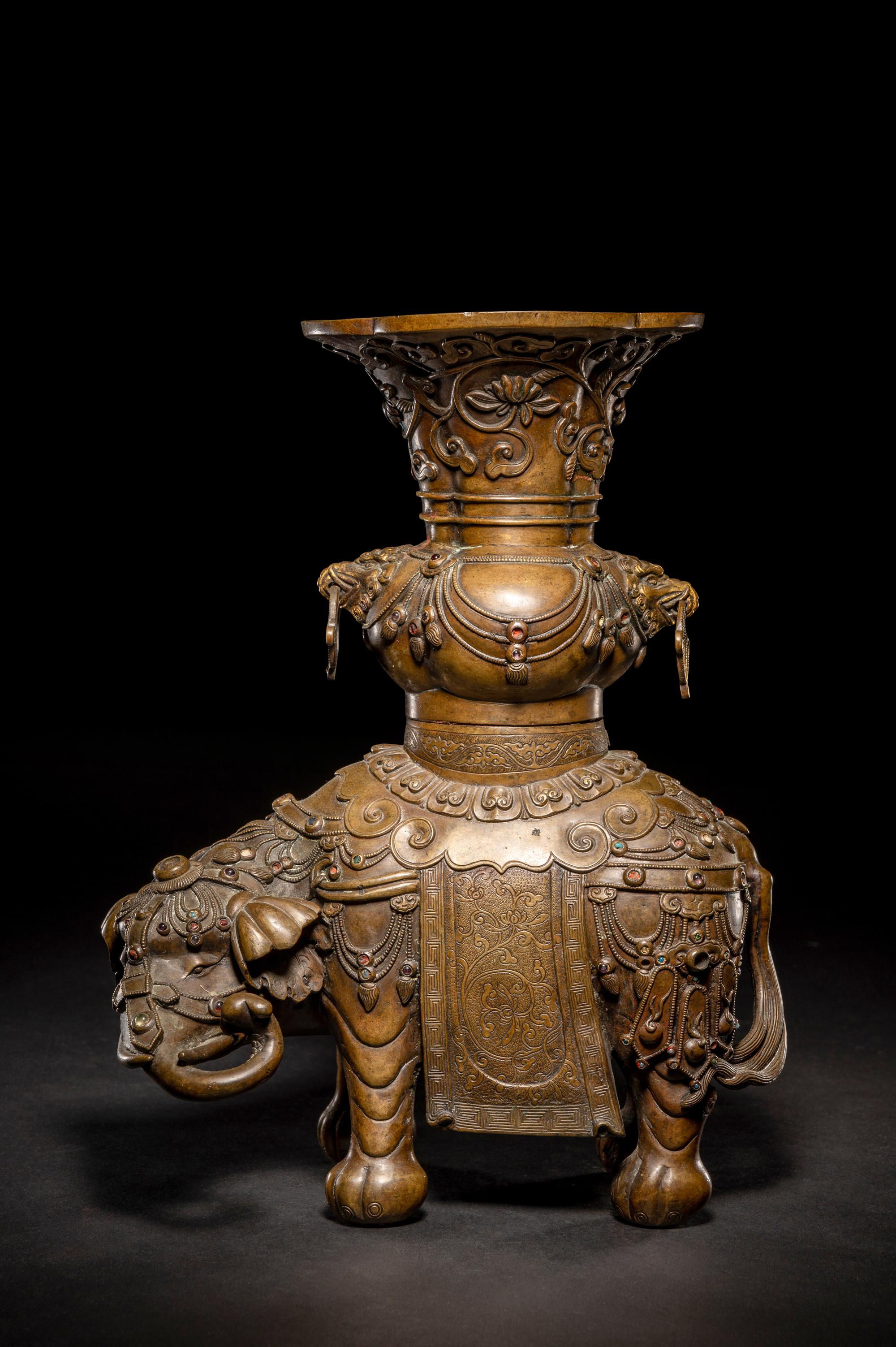 An Embellished Bronze Figure of an Elephant and Vase