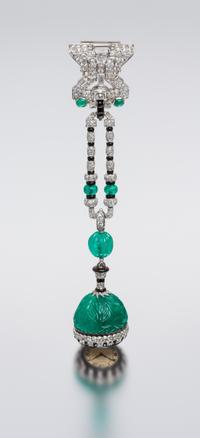 An Art Deco Platinum, Emerald, Diamond, Onyx and Enamel Lapel Watch, Cartier, 37.00 dwts.