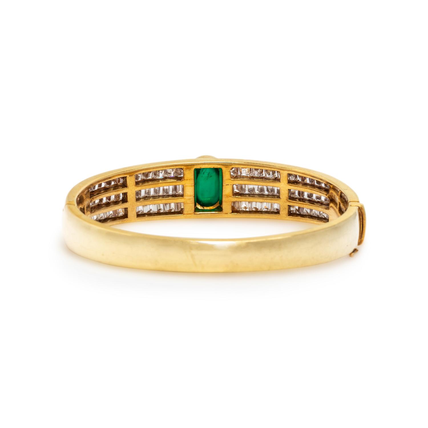 YELLOW GOLD, EMERALD, AND DIAMOND BANGLE BRACELET