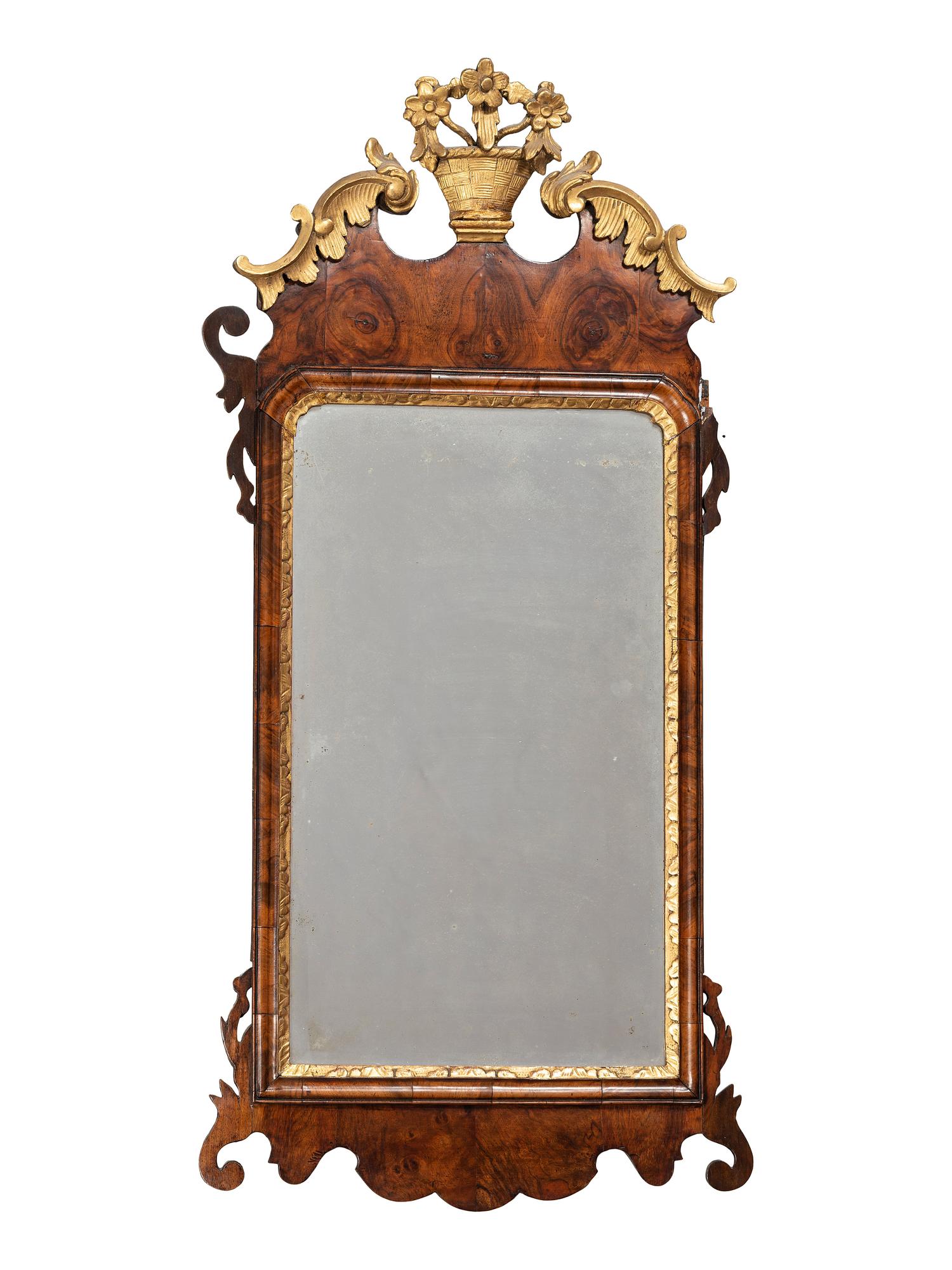 A George III Parcel Gilt and Carved Mahogany Mirror