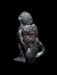 A Greek Bronze Satyr