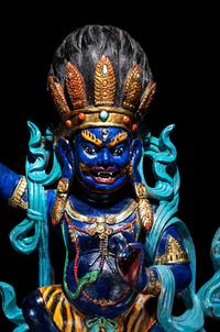A Large Tibetan Polychrome Painted Wood Figure of a Mahākāla