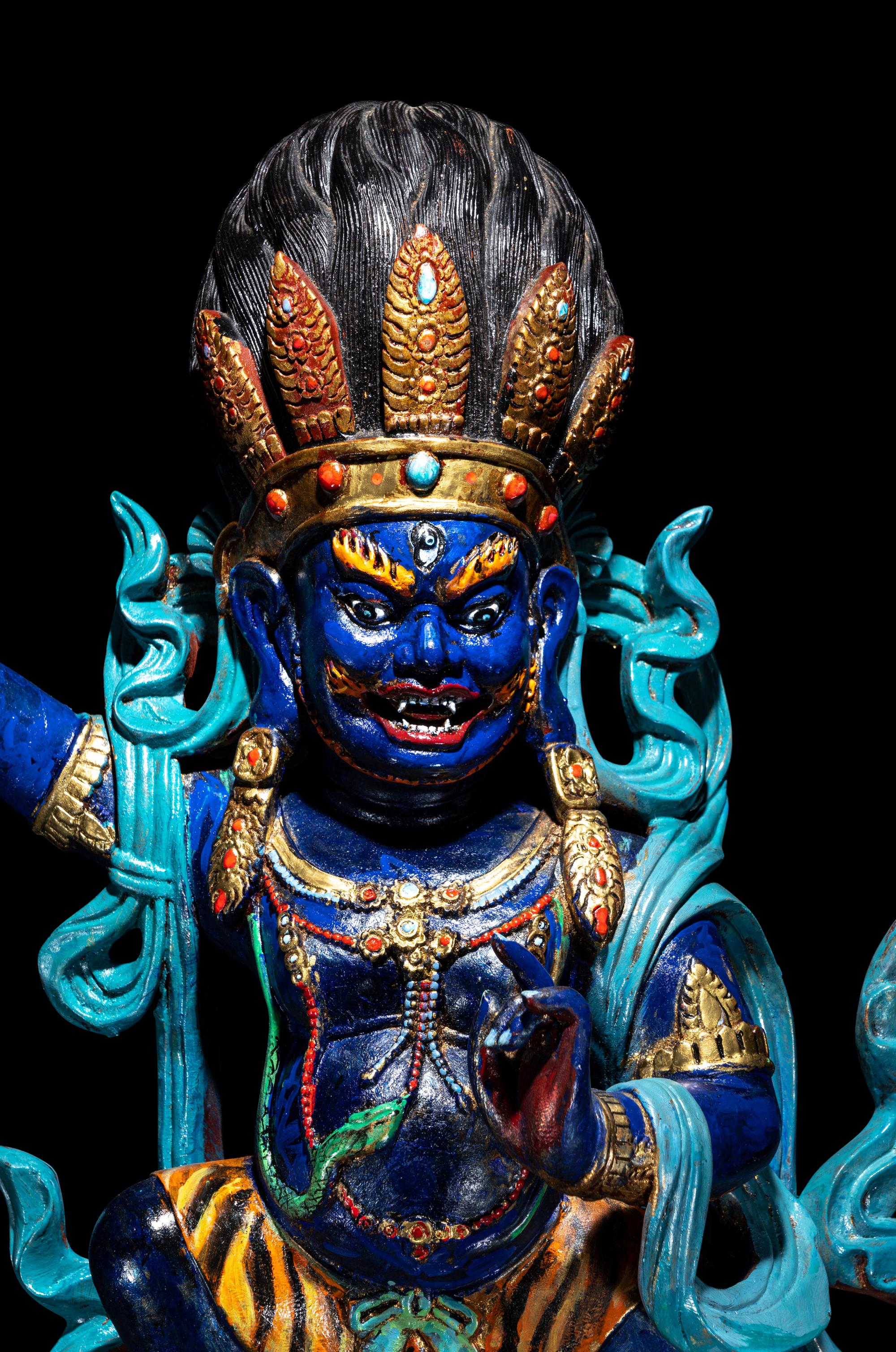 A Large Tibetan Polychrome Painted Wood Figure of a Mahākāla