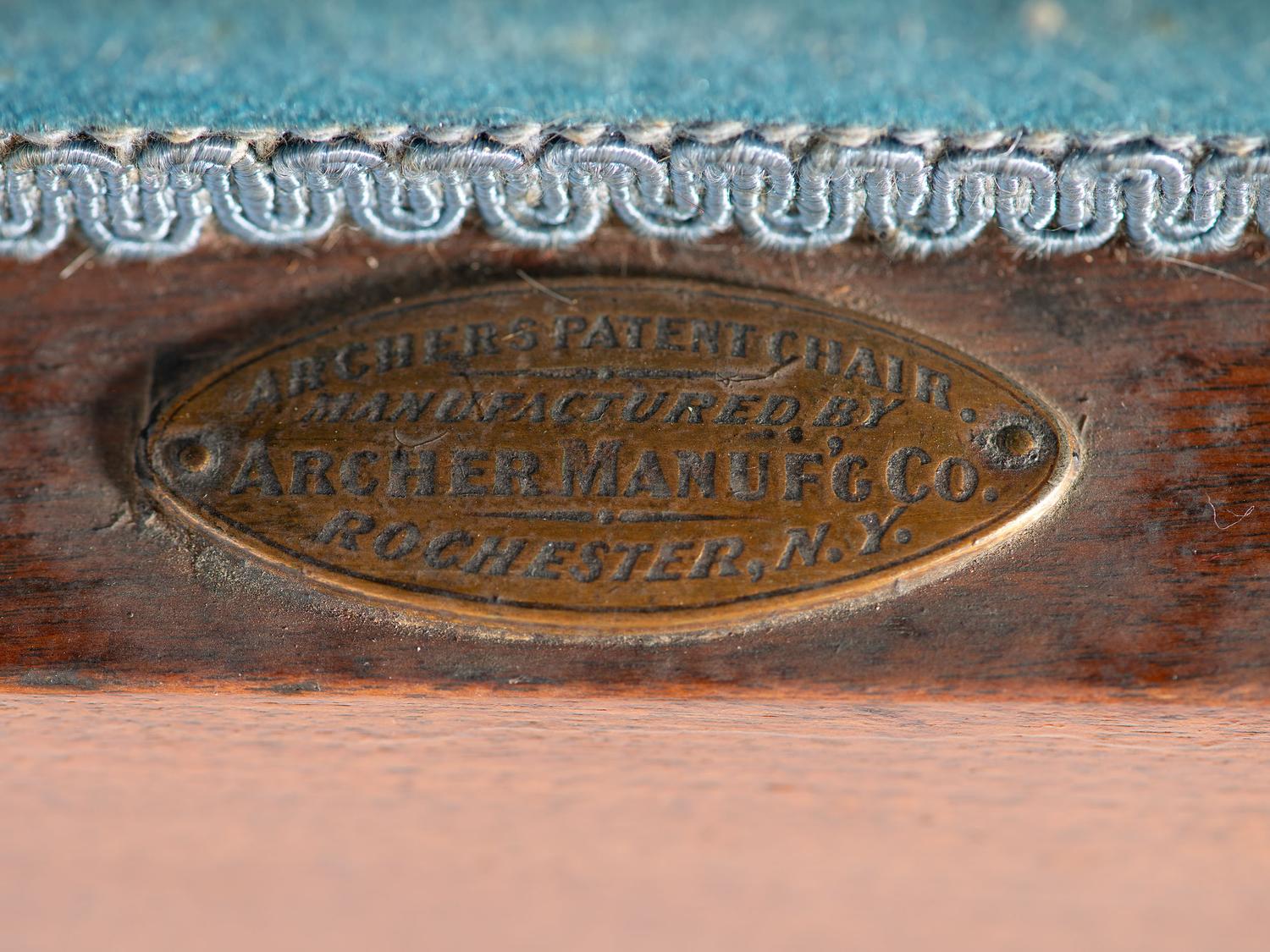 An Archer Velvet Upholstered Goose Neck Walnut Barber Chair and Footstool