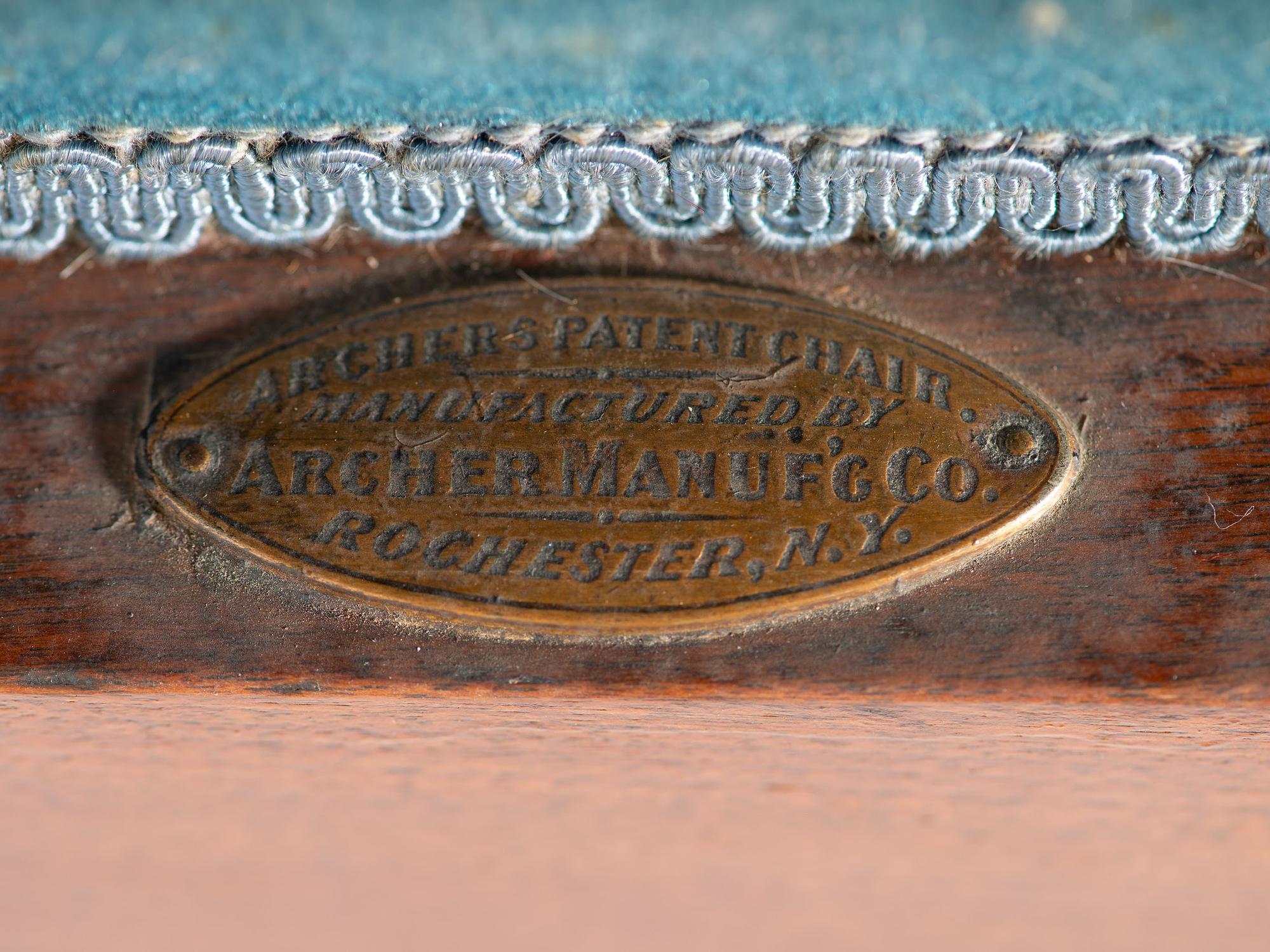 An Archer Velvet Upholstered Goose Neck Walnut Barber Chair and Footstool