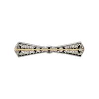 TIFFANY & CO., ART DECO, PLATINUM, DIAMOND, AND ONYX BOW BROOCH