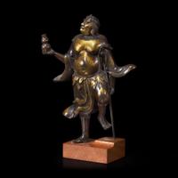 A finely modeled Chinese parcel-gilt and patinated bronze figure of Li Tieguai 部分漆金加画铁拐李铜造像 Late Ming/Early Qing dynasty ?????